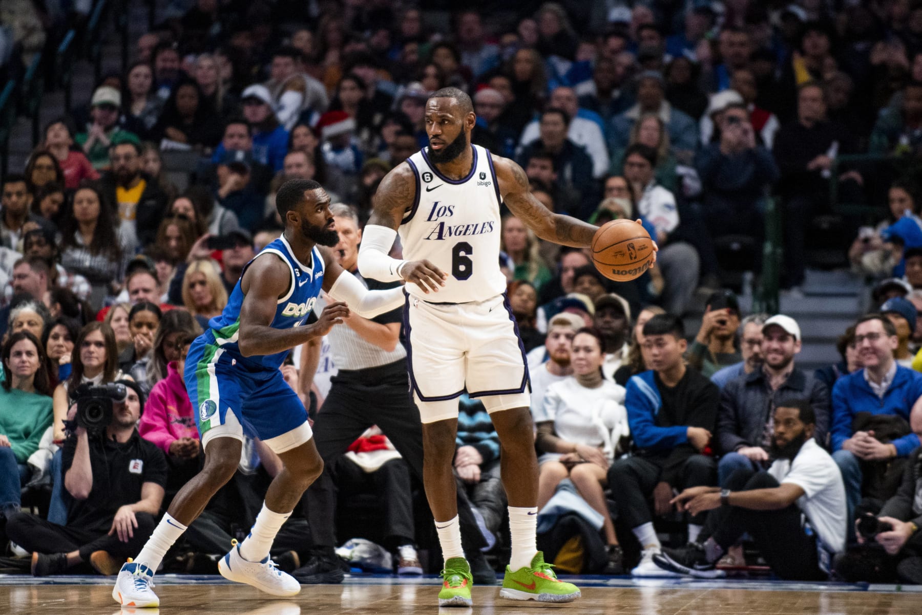 Los Angeles Lakers forward LeBron James (6) protects the ball as Dallas Mavericks forward Tim Hardaway Jr. (11) defends him in the second half of an NBA basketball game in Dallas, Sunday, Dec. 25, 2022. (AP Photo/Emil T. Lippe)
