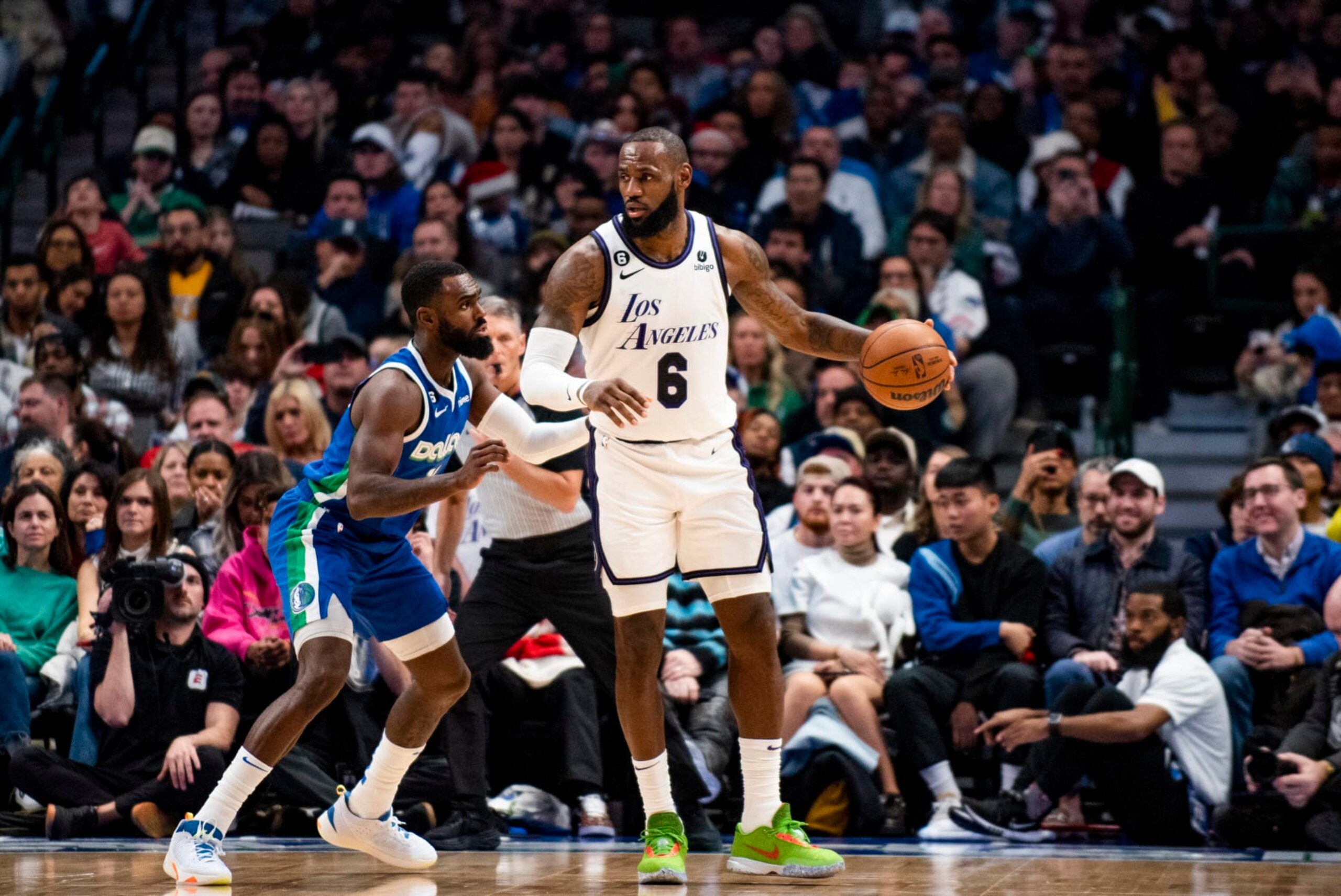 Los Angeles Lakers forward LeBron James (6) protects the ball as Dallas Mavericks forward Tim Hardaway Jr. (11) defends him in the second half of an NBA basketball game in Dallas, Sunday, Dec. 25, 2022. (AP Photo/Emil T. Lippe)