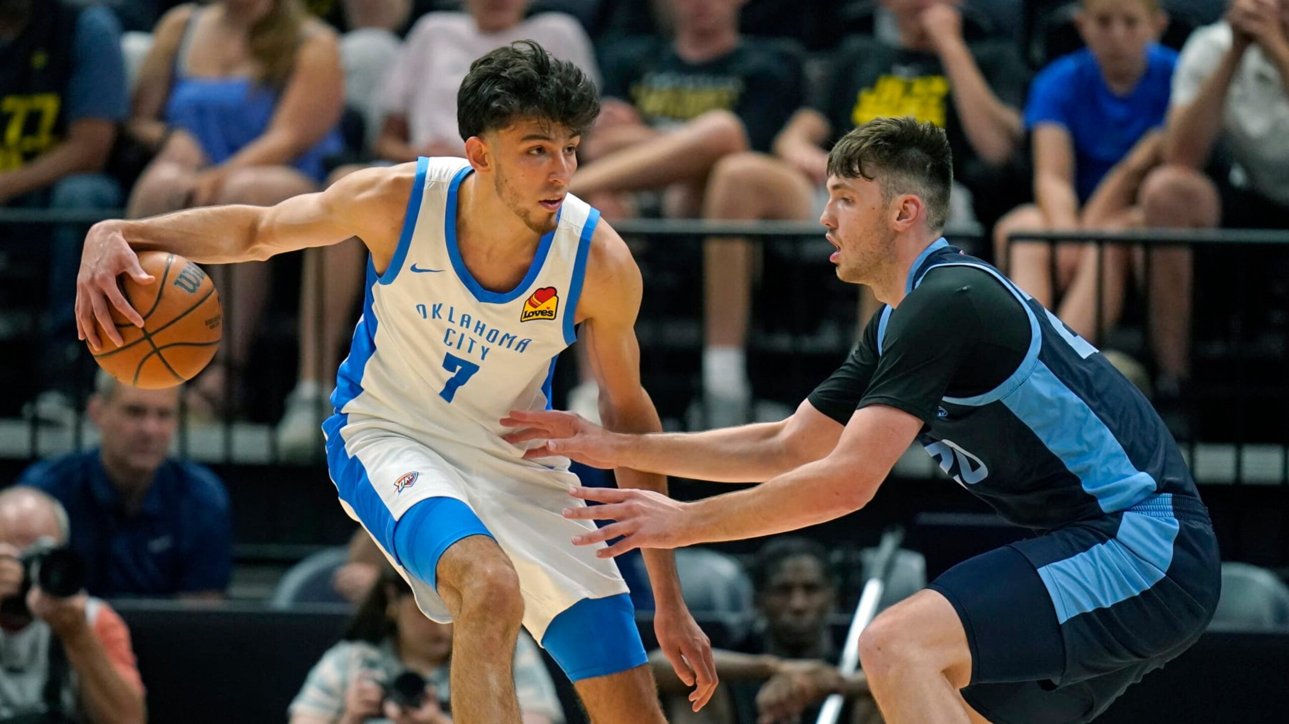 Memphis Grizzlies forward Matthew Hurt, right, guards Oklahoma City Thunder forward Chet Holmgren (7) during the first half during an NBA summer league basketball game Wednesday, July 5, 2023, in Salt Lake City. (AP Photo/Rick Bowmer)
