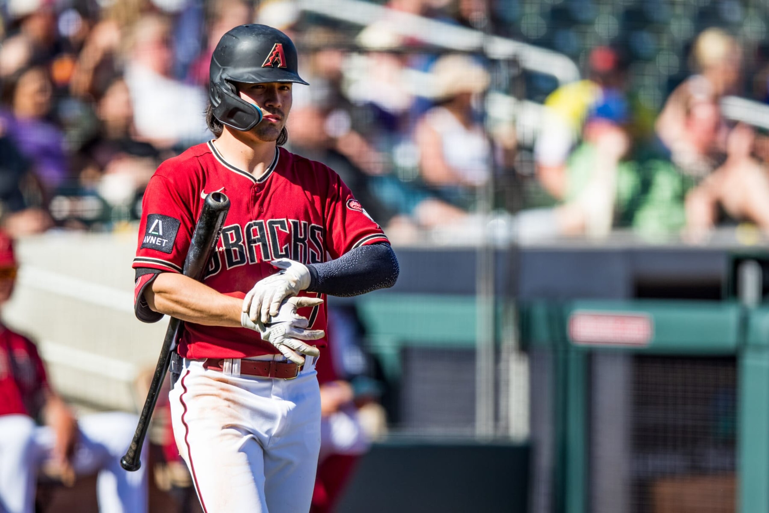 SCOTTSDALE, ARIZONA - MARCH 12: Corbin Carrol #7 of the Arizona Diamondbacks walks to home plate during the Spring Training game against the Colorado Rockies at Salt River Fields at Talking Stick on March 12, 2023 in Scottsdale, Arizona. (Photo by John E. Moore III/Getty Images)