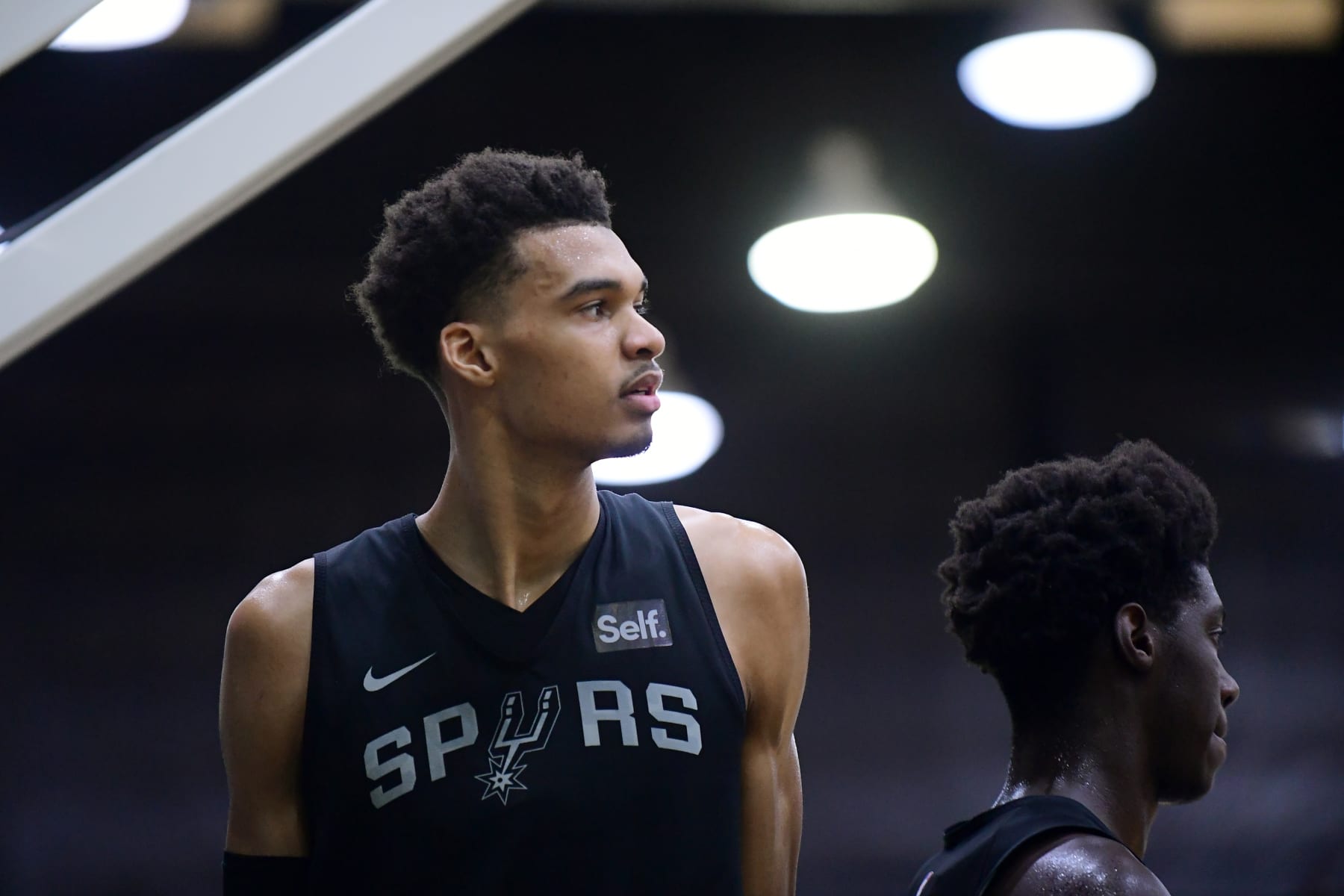 SAN ANTONIO, TX - JUNE 30: Victor Wembanyama of the San Antonio Spurs looks on during an open practice on June 30, 2023 at the AT&T Center in San Antonio, Texas. NOTE TO USER: User expressly acknowledges and agrees that, by downloading and or using this photograph, user is consenting to the terms and conditions of the Getty Images License Agreement. Mandatory Copyright Notice: Copyright 2023 NBAE (Photos by Michael Gonzales/NBAE via Getty Images)