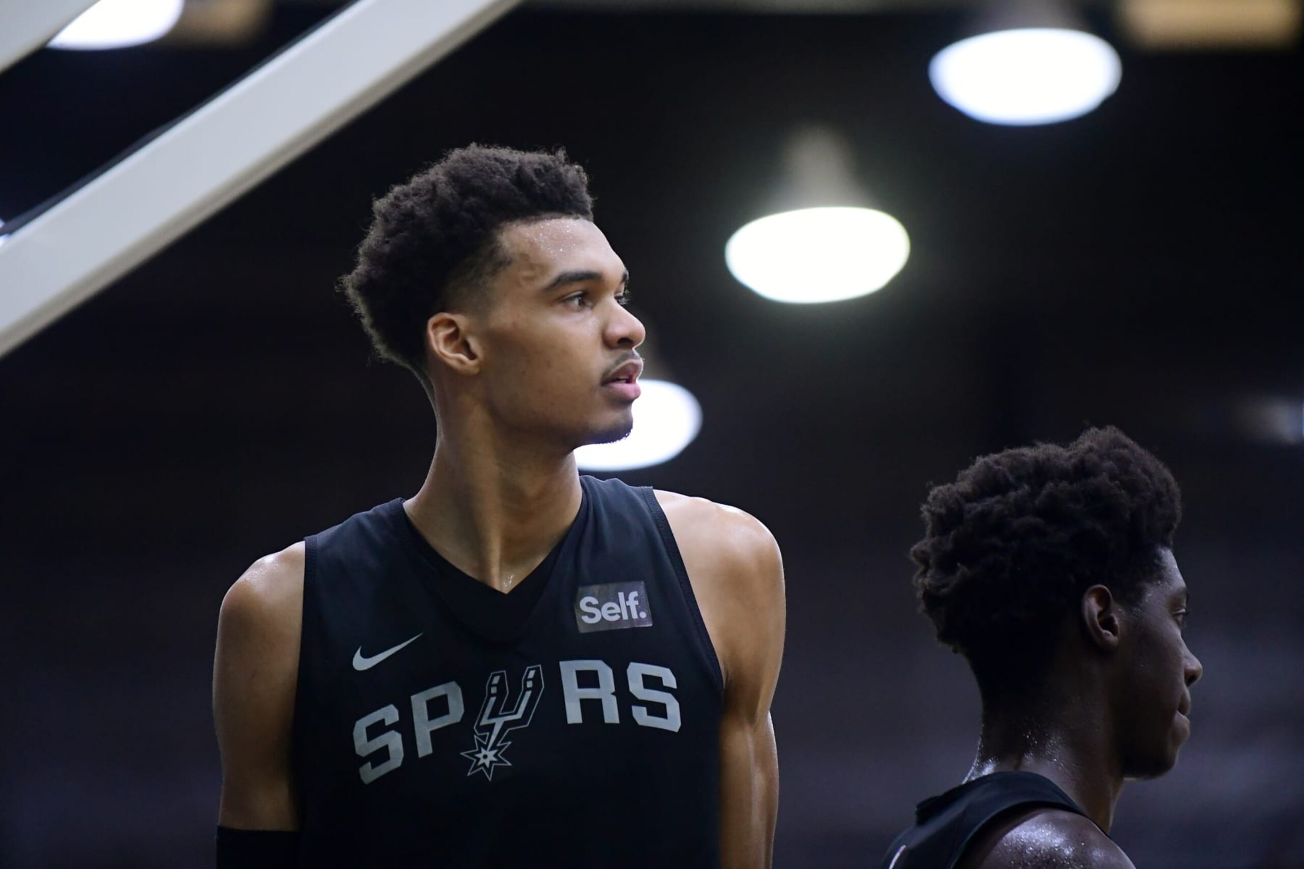 SAN ANTONIO, TX - JUNE 30: Victor Wembanyama of the San Antonio Spurs looks on during an open practice on June 30, 2023 at the AT&T Center in San Antonio, Texas. NOTE TO USER: User expressly acknowledges and agrees that, by downloading and or using this photograph, user is consenting to the terms and conditions of the Getty Images License Agreement. Mandatory Copyright Notice: Copyright 2023 NBAE (Photos by Michael Gonzales/NBAE via Getty Images)