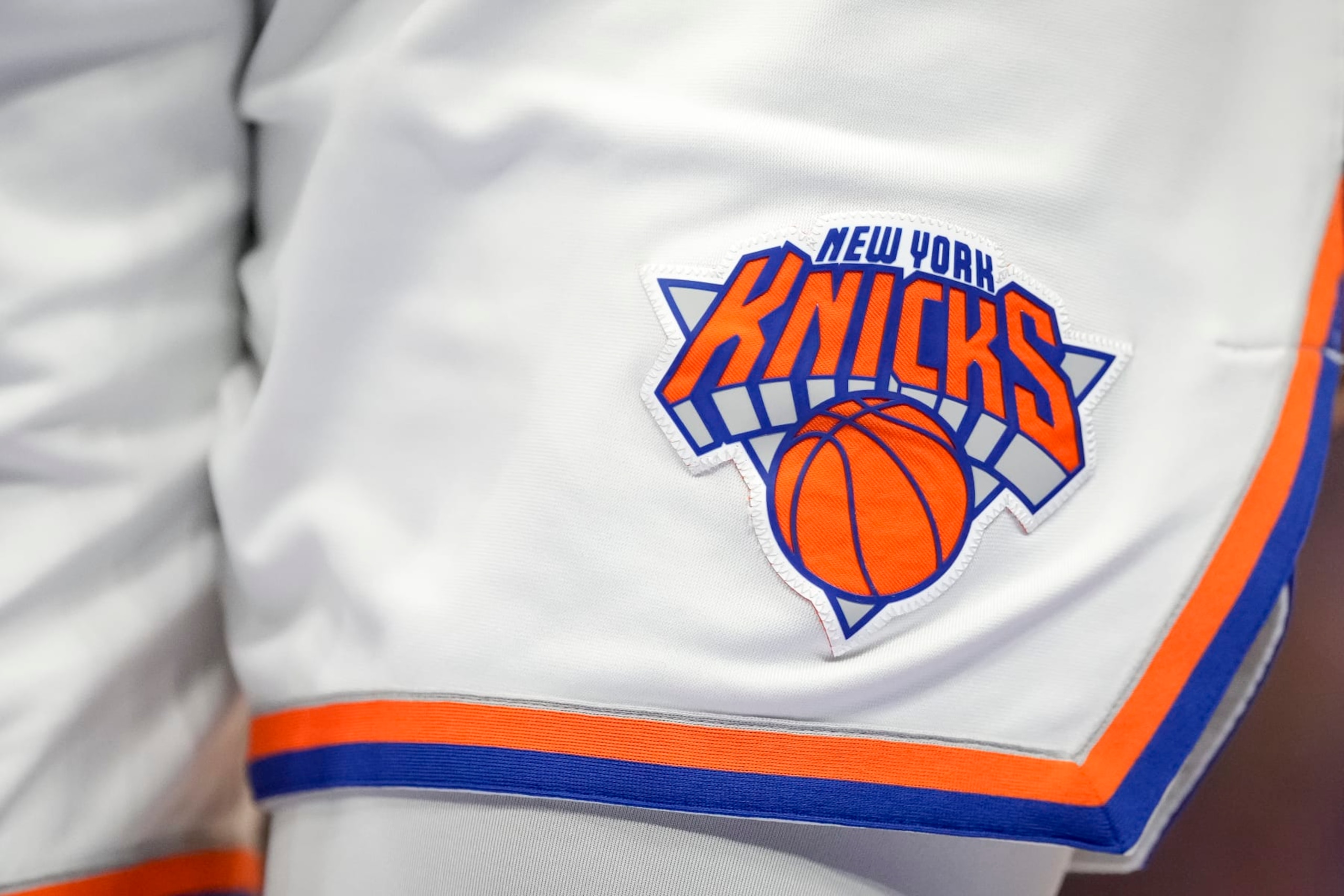 DETROIT, MICHIGAN - MARCH 27: A detail is pictured of the New York Knicks uniform and New York Knicks logo during the fourth quarter against the Detroit Pistons at Little Caesars Arena on March 27, 2022 in Detroit, Michigan. NOTE TO USER: User expressly acknowledges and agrees that, by downloading and or using this photograph, User is consenting to the terms and conditions of the Getty Images License Agreement. (Photo by Nic Antaya/Getty Images) DETROIT, MICHIGAN - MARCH 27: A detail is pictured of the New York Knicks uniform and New York Knicks logo during the fourth quarter against the Detroit Pistons at Little Caesars Arena on March 27, 2022 in Detroit, Michigan. NOTE TO USER: User expressly acknowledges and agrees that, by downloading and or using this photograph, User is consenting to the terms and conditions of the Getty Images License Agreement. (Photo by Nic Antaya/Getty Images)