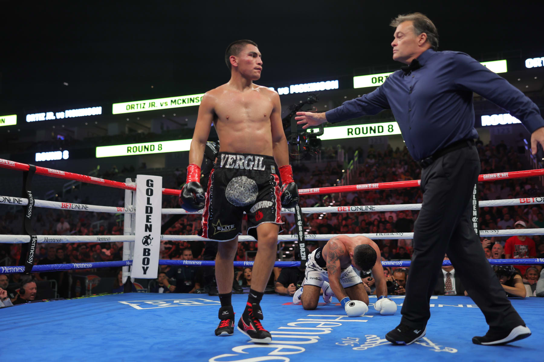 FORT WORTH, TEXAS - AUGUST 6: Vergil Ortiz Jr. (L) stops Michael McKinson (R) with TKO in the 9th round at their WBO International Welterweight fight at Dickies Arena on August 6, 2022 in Fort Worth, Texas. (Photo by Cris Esqueda/Golden Boy/Getty Images)
