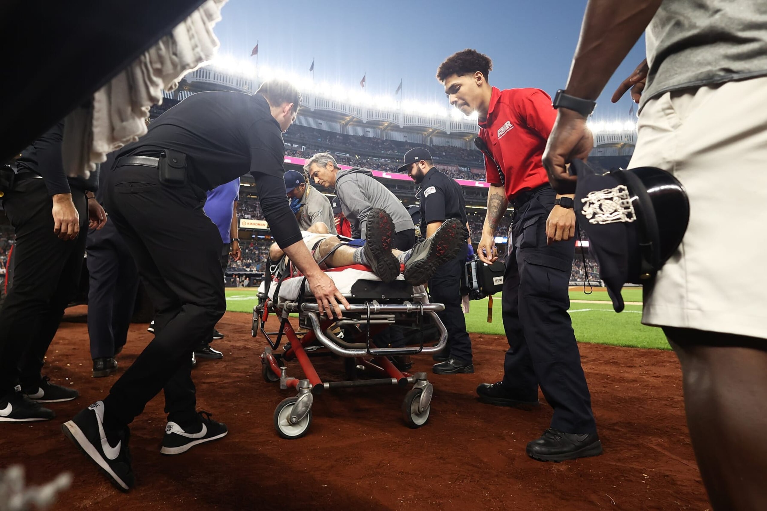 NEW YORK, NEW YORK - JULY 05: A camera man is carted off the field after getting hit by an errant throw in the fifth inning during the game between the New York Yankees and the Baltimore Orioles at Yankee Stadium on July 5, 2023 in Bronx borough of New York City. (Photo by Mike Stobe/Getty Images)