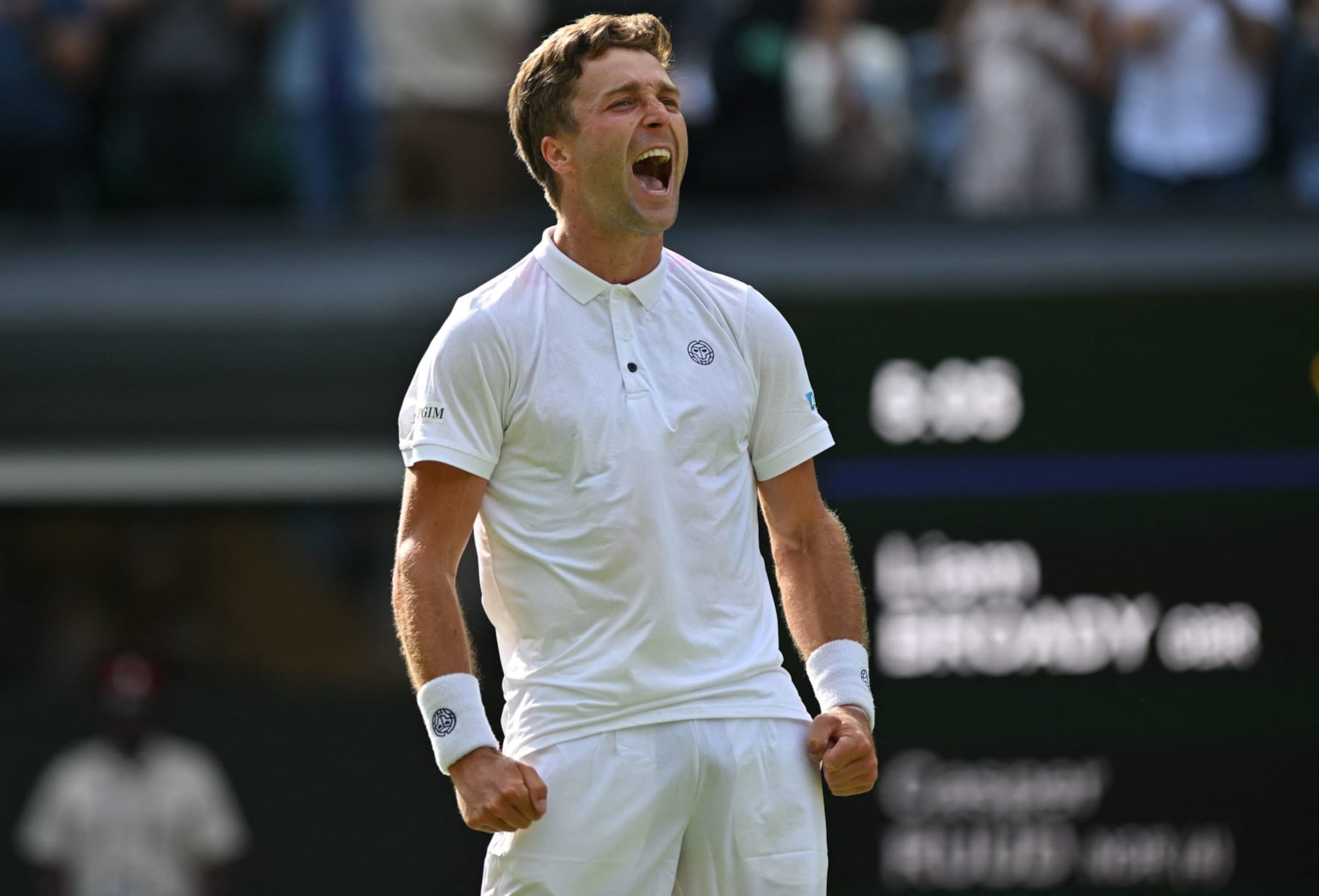 Britain's Liam Broady celebrates beating Norway's Casper Ruud after winning their men's singles tennis match on the fourth day of the 2023 Wimbledon Championships at The All England Tennis Club in Wimbledon, southwest London, on July 6, 2023. (Photo by Glyn KIRK / AFP) / RESTRICTED TO EDITORIAL USE (Photo by GLYN KIRK/AFP via Getty Images)