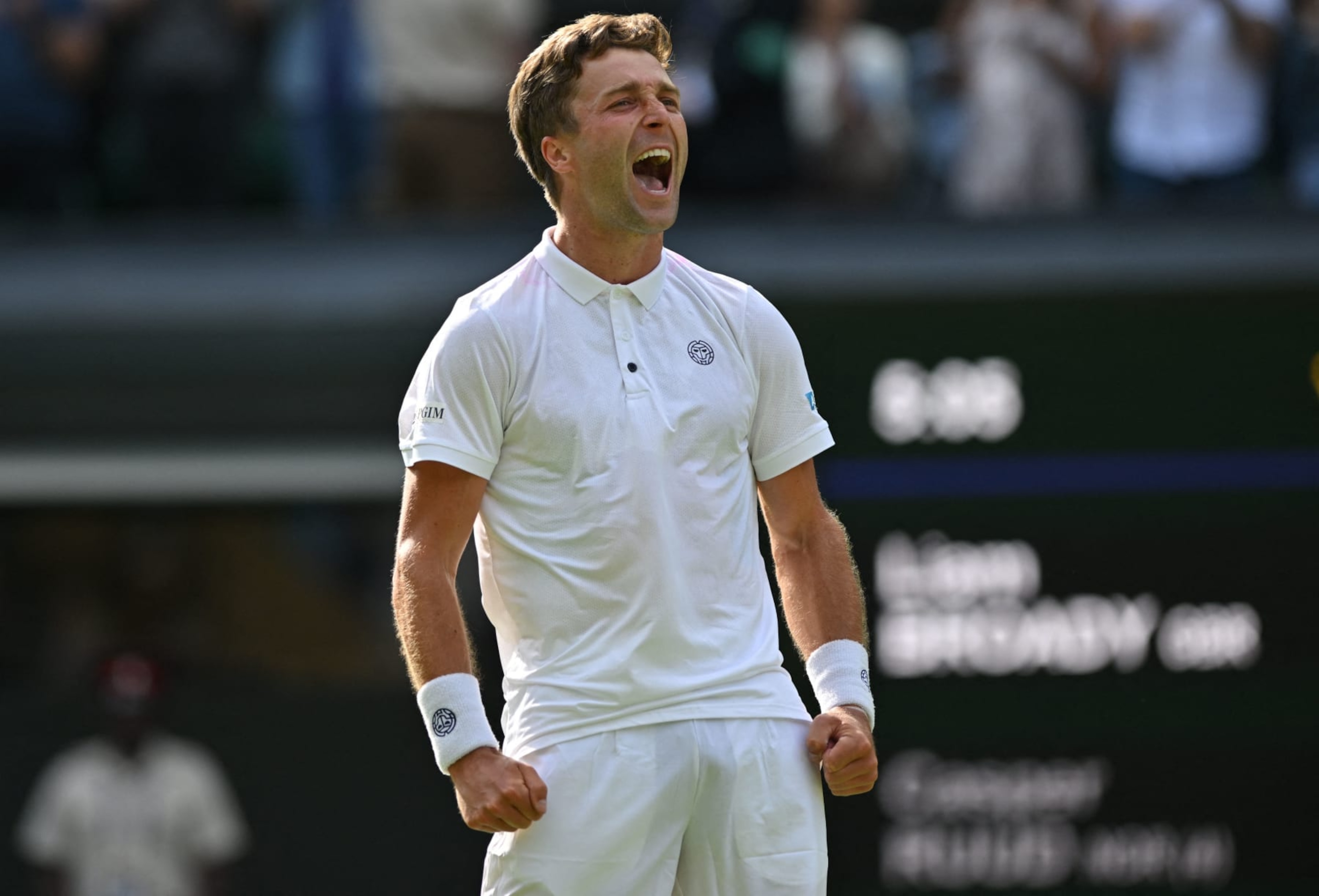 Britain's Liam Broady celebrates beating Norway's Casper Ruud after winning their men's singles tennis match on the fourth day of the 2023 Wimbledon Championships at The All England Tennis Club in Wimbledon, southwest London, on July 6, 2023. (Photo by Glyn KIRK / AFP) / RESTRICTED TO EDITORIAL USE (Photo by GLYN KIRK/AFP via Getty Images) Britain's Liam Broady celebrates beating Norway's Casper Ruud after winning their men's singles tennis match on the fourth day of the 2023 Wimbledon Championships at The All England Tennis Club in Wimbledon, southwest London, on July 6, 2023. (Photo by Glyn KIRK / AFP) / RESTRICTED TO EDITORIAL USE (Photo by GLYN KIRK/AFP via Getty Images)