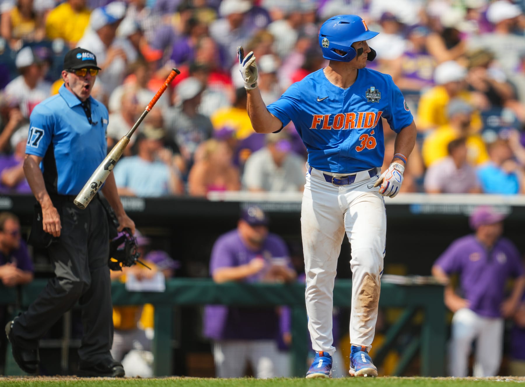 OMAHA, NEBRASKA - JUNE 25: Wyatt Langford #36 of the Florida Gators flips his bat after hitting a three-run home run during the sixth inning of Game 2 of the NCAA College World Series baseball finals against the LSU Tigers at Charles Schwab Field on June 25, 2023 in Omaha, Nebraska. (Photo by Jay Biggerstaff/Getty Images)