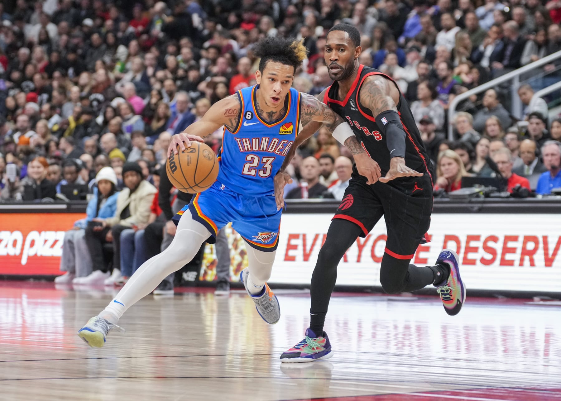 Oklahoma City's Tre Mann drives by Will Barton