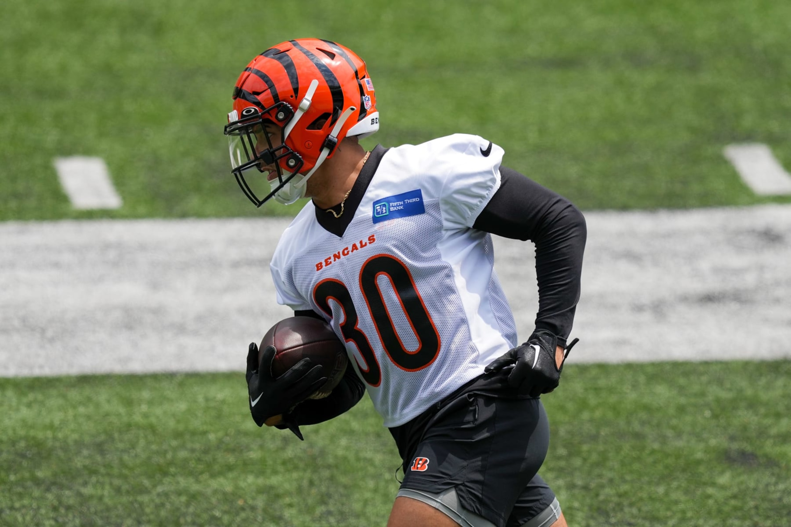 CINCINNATI, OHIO - JUNE 13: Chase Brown #30 of the Cincinnati Bengals participates in a drill during an offseason workout on June 13, 2023 in Cincinnati, Ohio. (Photo by Dylan Buell/Getty Images)