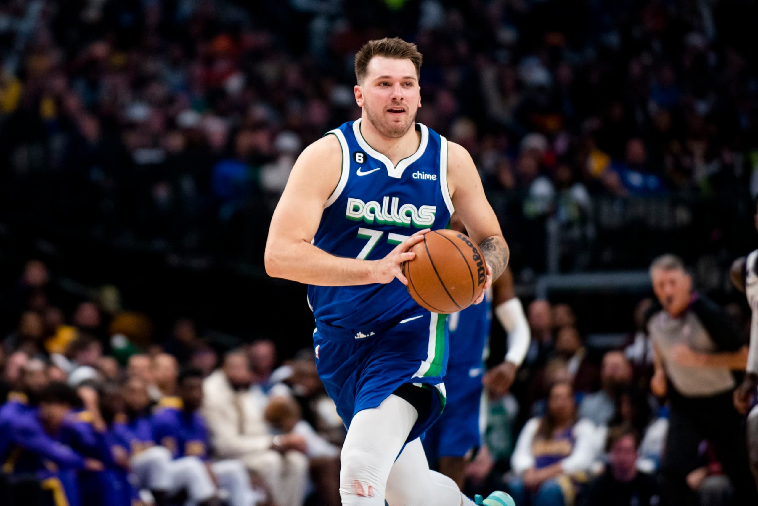Dallas Mavericks guard Luka Doncic (77) prepares to pass the ball to a teammate in the second half of an NBA basketball game against the Los Angeles Lakers in Dallas, Sunday, Dec. 25, 2022. (AP Photo/Emil T. Lippe) Dallas Mavericks guard Luka Doncic (77) prepares to pass the ball to a teammate in the second half of an NBA basketball game against the Los Angeles Lakers in Dallas, Sunday, Dec. 25, 2022. (AP Photo/Emil T. Lippe)