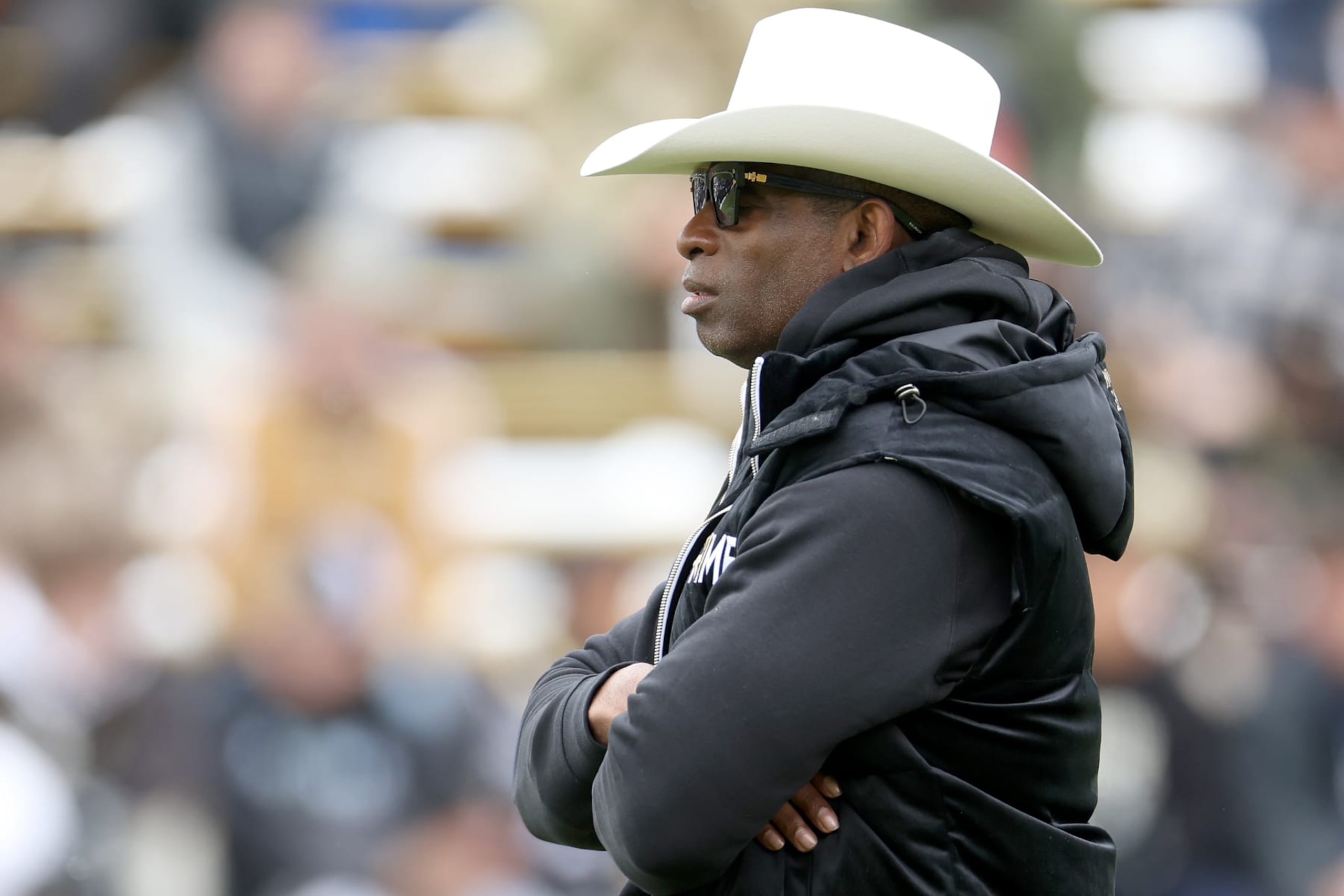 BOULDER, COLORADO - APRIL 22: Head coach Deion Sanders of the Colorado Buffaloes watches as his team warms up prior to their spring game at Folsom Field on April 22, 2023 in Boulder, Colorado. (Photo by Matthew Stockman/Getty Images) BOULDER, COLORADO - APRIL 22: Head coach Deion Sanders of the Colorado Buffaloes watches as his team warms up prior to their spring game at Folsom Field on April 22, 2023 in Boulder, Colorado. (Photo by Matthew Stockman/Getty Images)