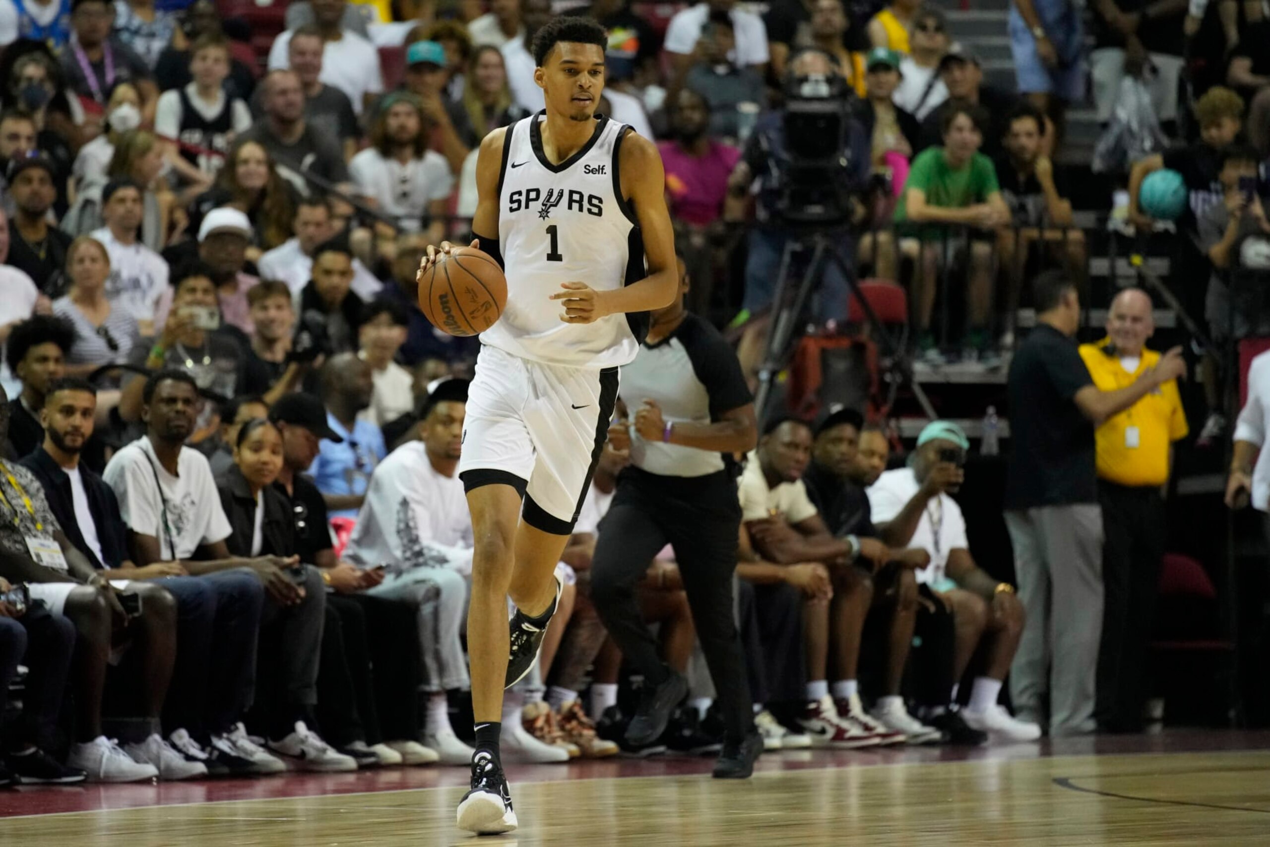 San Antonio Spurs' Victor Wembanyama drives against the Charlotte Hornets during the first half of an NBA summer league basketball game Friday, July 7, 2023, in Las Vegas. (AP Photo/John Locher)