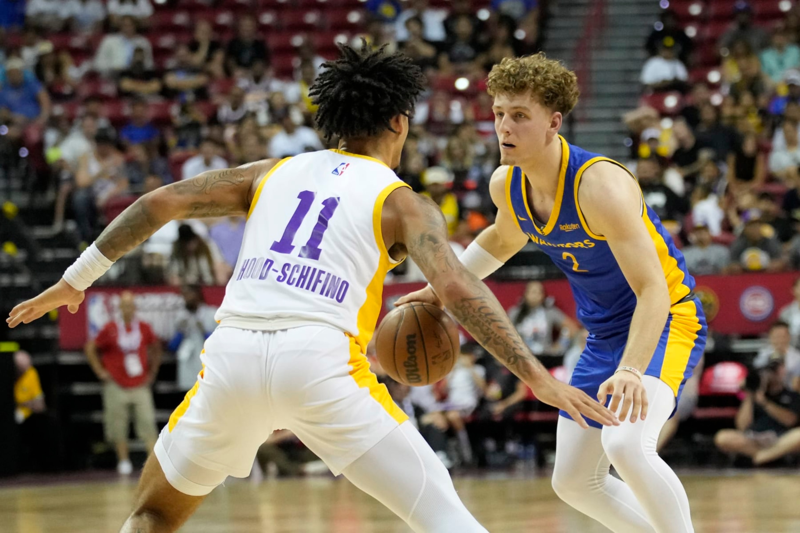 Golden State Warriors' Brandin Podziemski, right, drives against Los Angeles Lakers' Jalen Hood-Schifino during the first half of an NBA summer league basketball game Friday, July 7, 2023, in Las Vegas. (AP Photo/John Locher) Golden State Warriors' Brandin Podziemski, right, drives against Los Angeles Lakers' Jalen Hood-Schifino during the first half of an NBA summer league basketball game Friday, July 7, 2023, in Las Vegas. (AP Photo/John Locher)