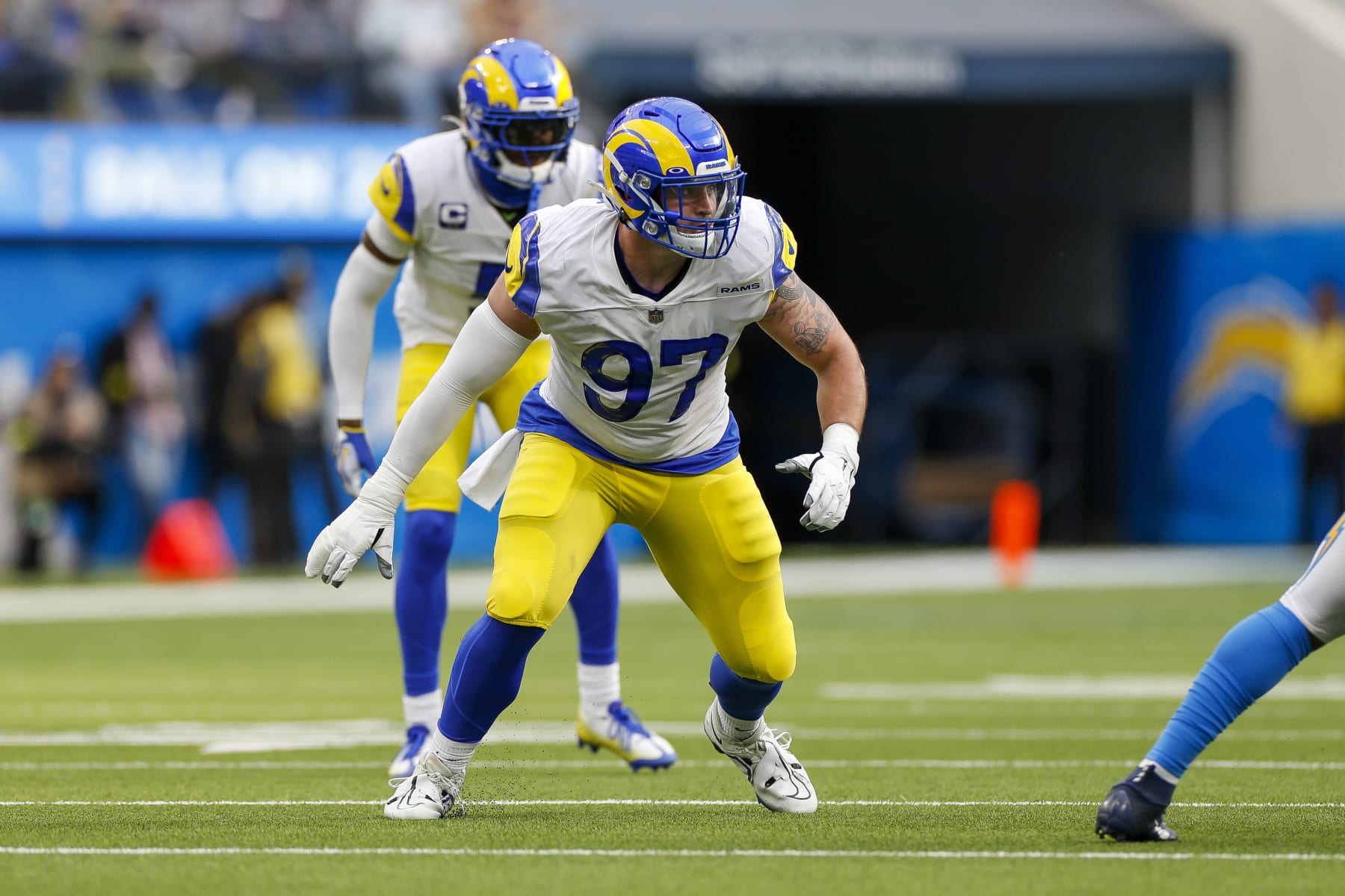 INGLEWOOD, CA - JANUARY 01: Los Angeles Rams defensive tackle Michael Hoecht (97) rushes during an NFL regular season game between the Los Angeles Rams and the Los Angeles Chargers on January 01, 2023, at SoFi Stadium in Inglewood, CA. (Photo by Brandon Sloter/Icon Sportswire via Getty Images)