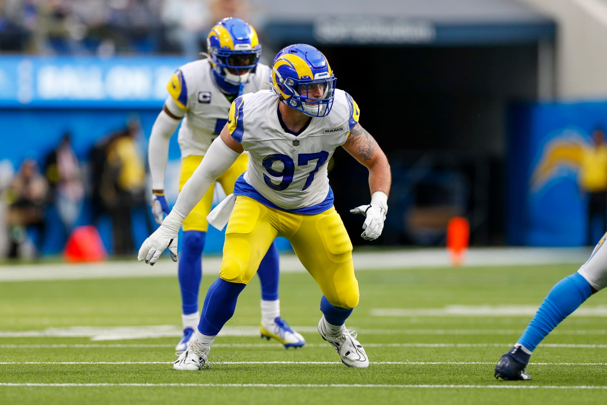 INGLEWOOD, CA - JANUARY 01: Los Angeles Rams defensive tackle Michael Hoecht (97) rushes during an NFL regular season game between the Los Angeles Rams and the Los Angeles Chargers on January 01, 2023, at SoFi Stadium in Inglewood, CA. (Photo by Brandon Sloter/Icon Sportswire via Getty Images)