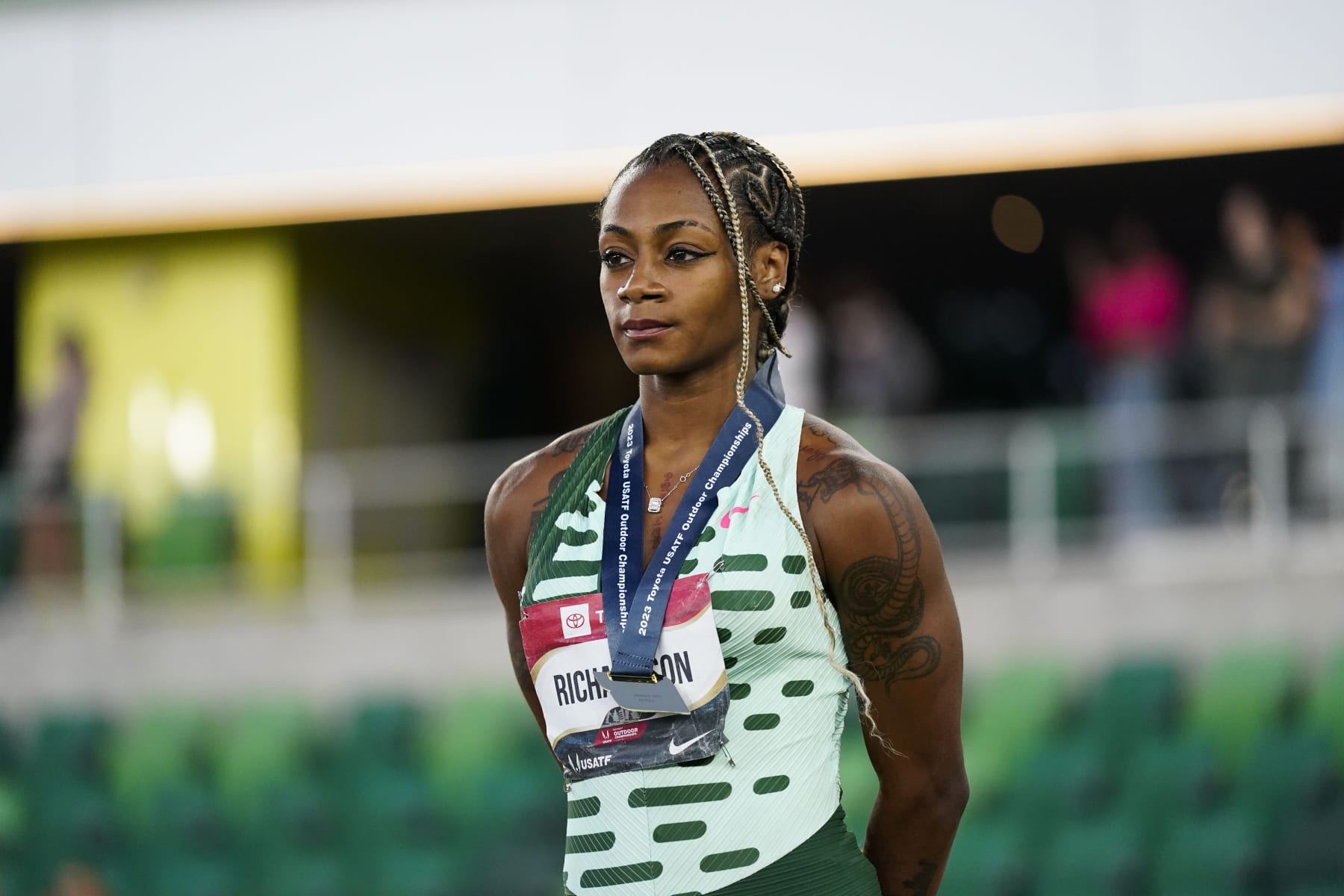 Sha'Carri Richardson, who won the gold medal in the women's 100 meter final, stands during a medal ceremony during the U.S. track and field championships in Eugene, Ore., Friday, July 7, 2023. (AP Photo/Ashley Landis)