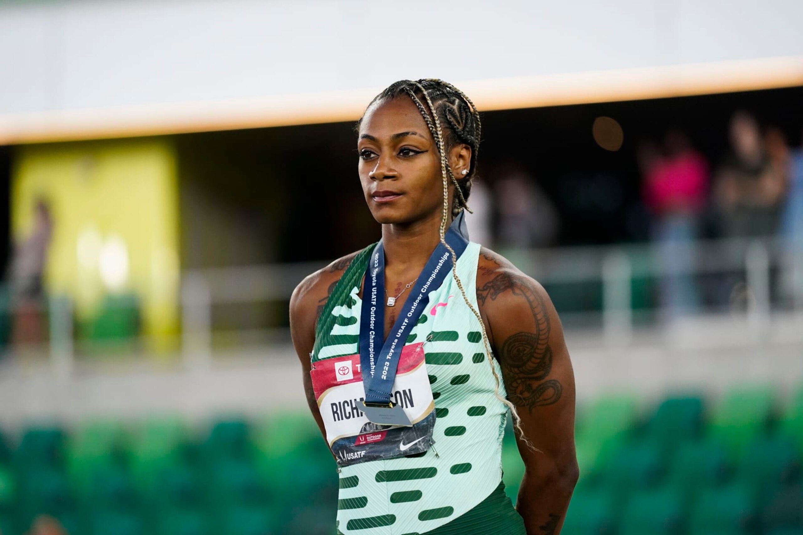 Sha'Carri Richardson, who won the gold medal in the women's 100 meter final, stands during a medal ceremony during the U.S. track and field championships in Eugene, Ore., Friday, July 7, 2023. (AP Photo/Ashley Landis)