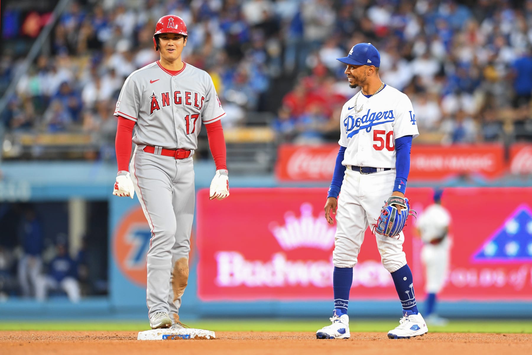 LOS ANGELES, CA - JULY 07: Los Angeles Angels designated hitter Shohei Ohtani (17) jokes with Los Angeles Dodgers second baseman Mookie Betts (50) during the MLB game between the Los Angeles Angels and the Los Angeles Dodgers on July 7, 2023 at Dodger Stadium in Los Angeles, CA. (Photo by Brian Rothmuller/Icon Sportswire via Getty Images) LOS ANGELES, CA - JULY 07: Los Angeles Angels designated hitter Shohei Ohtani (17) jokes with Los Angeles Dodgers second baseman Mookie Betts (50) during the MLB game between the Los Angeles Angels and the Los Angeles Dodgers on July 7, 2023 at Dodger Stadium in Los Angeles, CA. (Photo by Brian Rothmuller/Icon Sportswire via Getty Images)