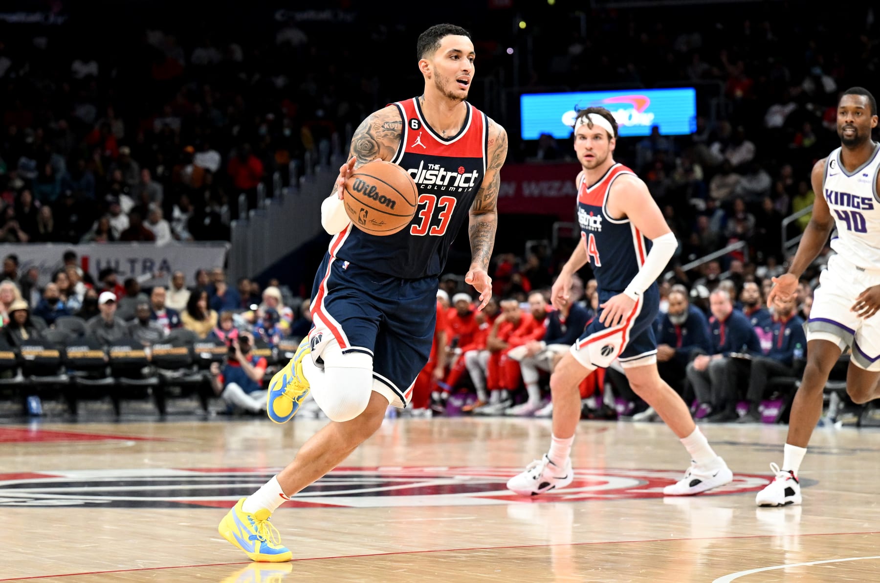 WASHINGTON, DC - MARCH 18: Kyle Kuzma #33 of the Washington Wizards handles the ball against the Sacramento Kings at Capital One Arena on March 18, 2023 in Washington, DC.  NOTE TO USER: User expressly acknowledges and agrees that, by downloading and or using this photograph, User is consenting to the terms and conditions of the Getty Images License Agreement.  (Photo by G Fiume/Getty Images)