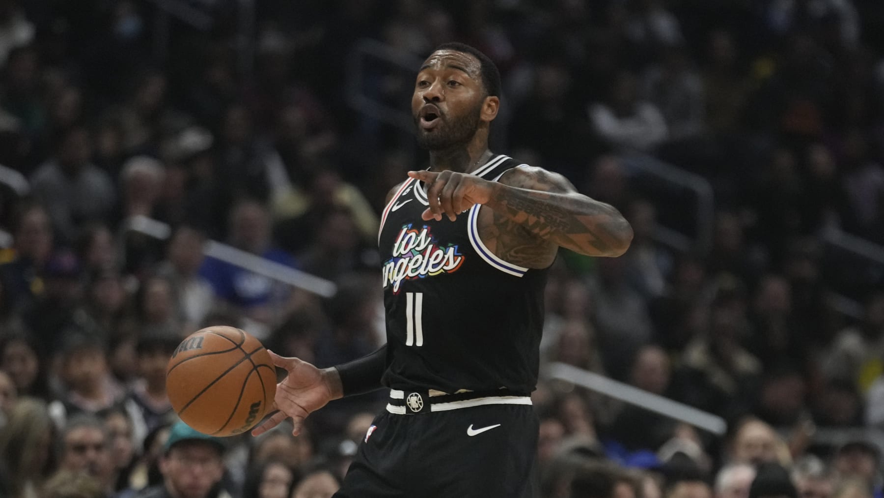 Los Angeles Clippers guard John Wall dribbles during an NBA basketball game against the Denver Nuggets Friday, Jan. 13, 2023, in Los Angeles. (AP Photo/Marcio Jose Sanchez)