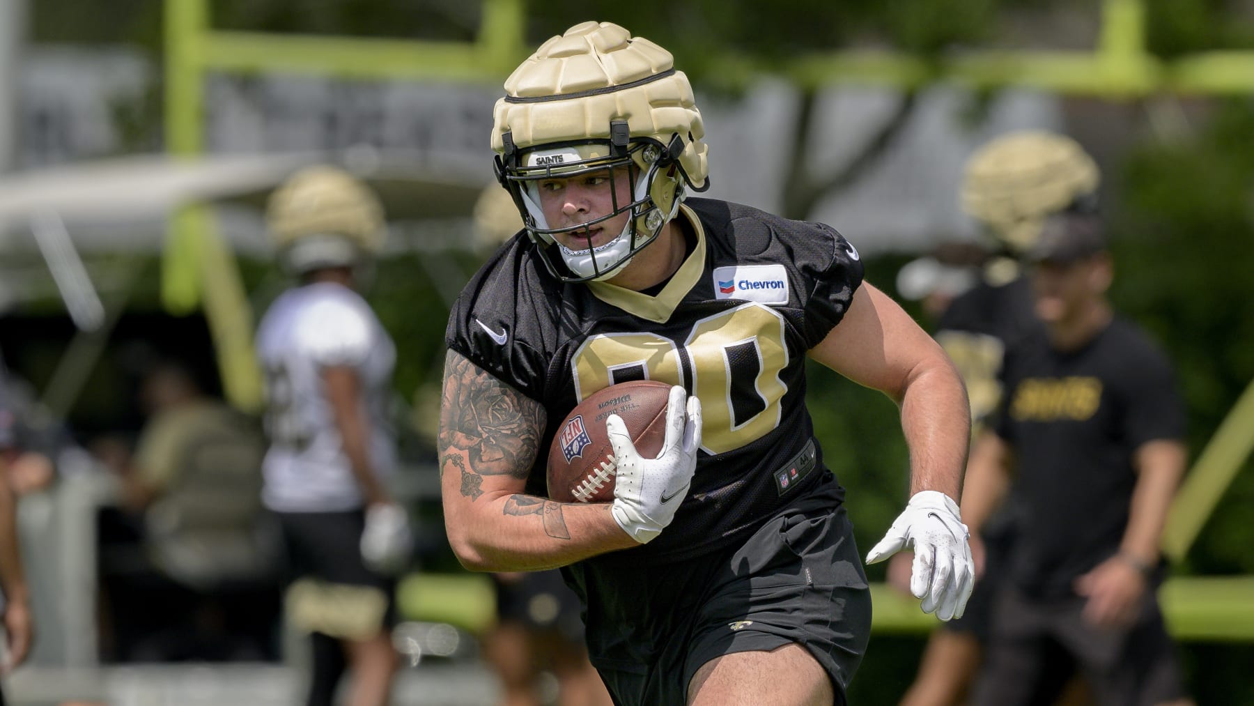 New Orleans Saints defensive tackle Bryan Bresee (90) runs a drill during the NFL football team's rookie minicamp in Metairie, La., Saturday, May 13, 2023. (AP Photo/Matthew Hinton)