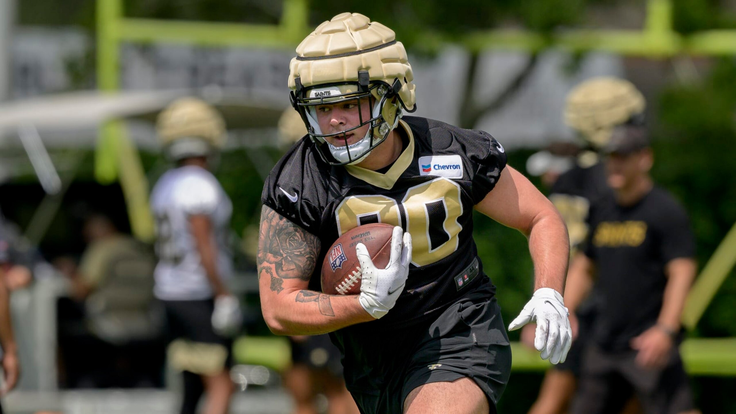 New Orleans Saints defensive tackle Bryan Bresee (90) runs a drill during the NFL football team's rookie minicamp in Metairie, La., Saturday, May 13, 2023. (AP Photo/Matthew Hinton)