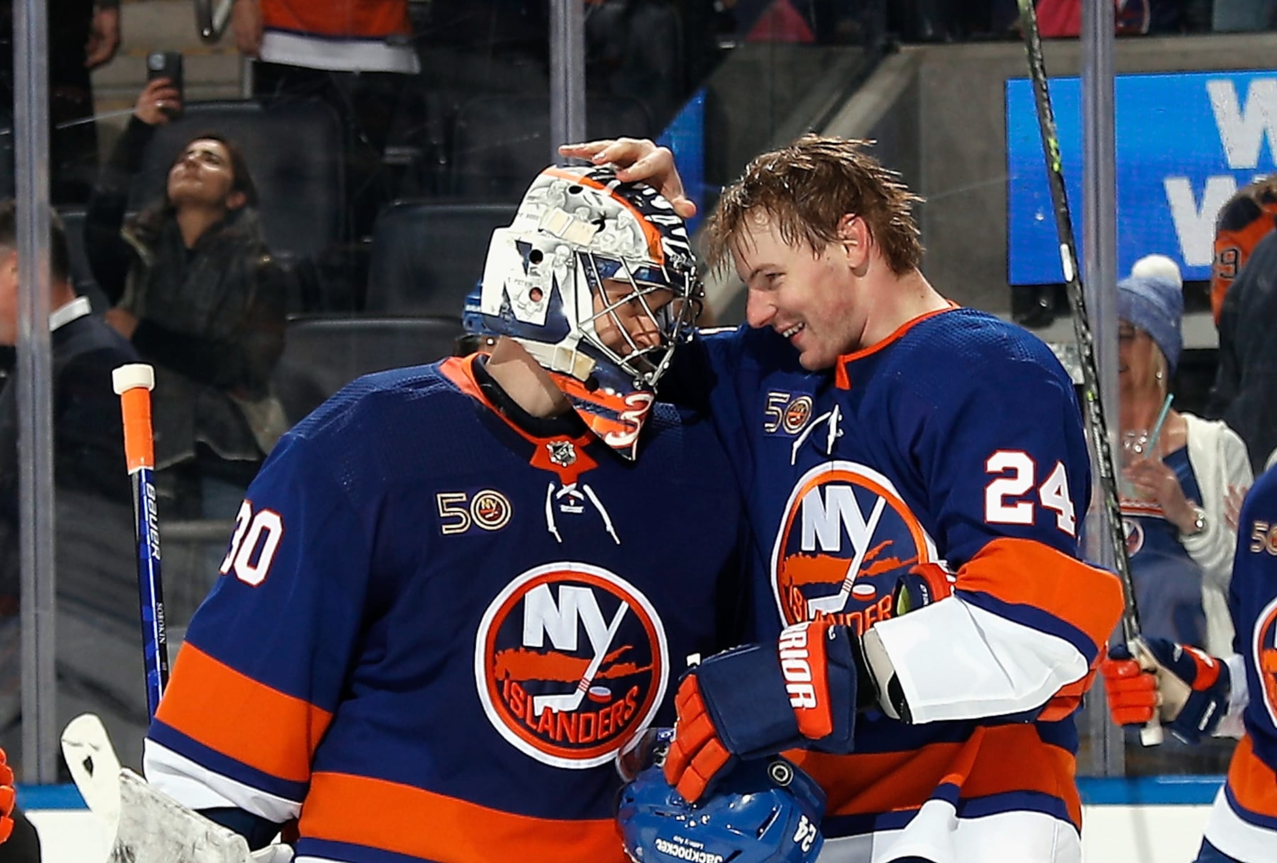 ELMONT, NEW YORK - FEBRUARY 17: Scott Mayfield #24 and Ilya Sorokin #30 of the New York Islanders celebrate their 5-4 victory over the Pittsburgh Penguins at UBS Arena on February 17, 2023 in Elmont, New York. (Photo by Bruce Bennett/Getty Images)