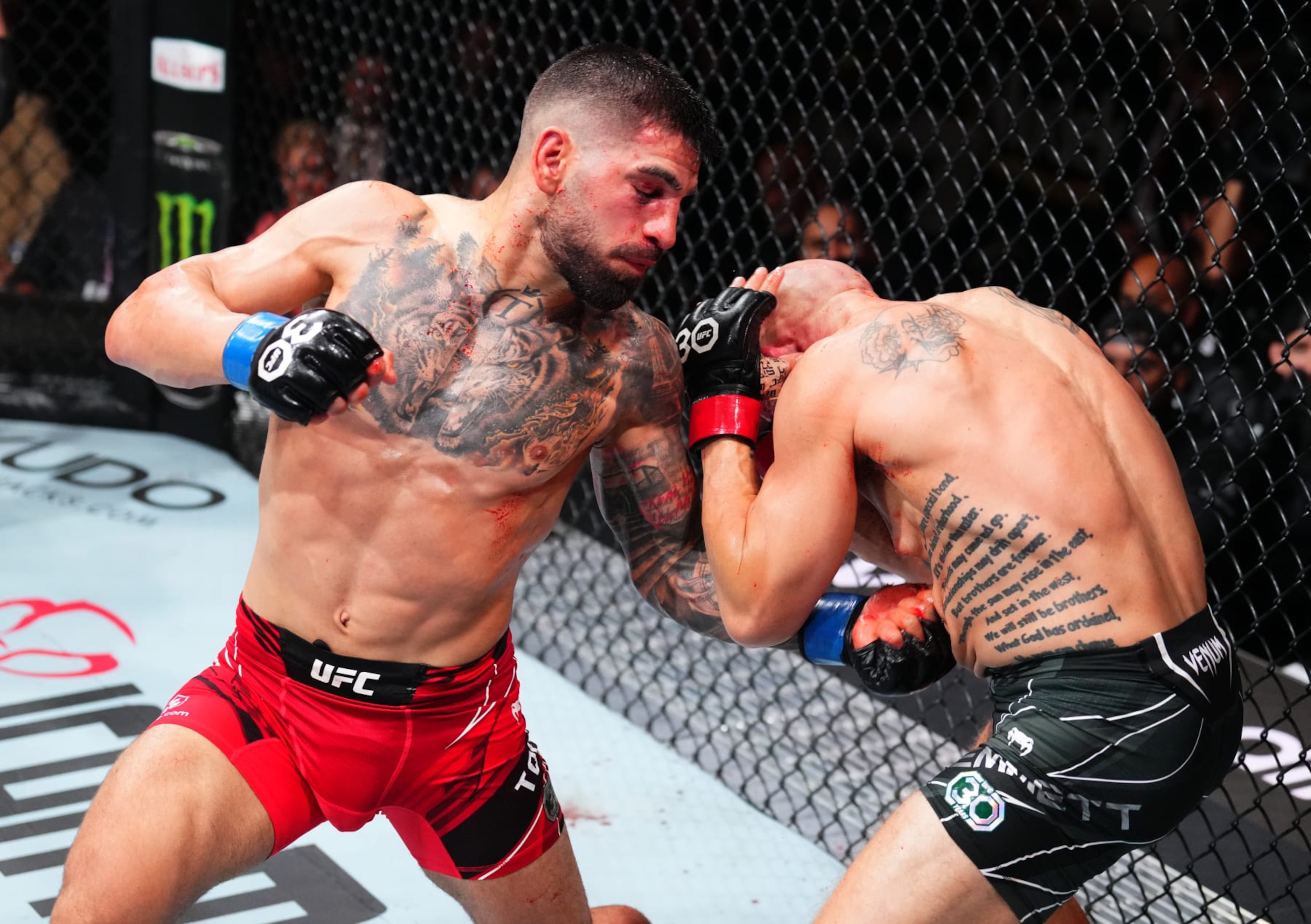 Ilia Topuria punches Josh Emmett Ilia Topuria punches Josh Emmett