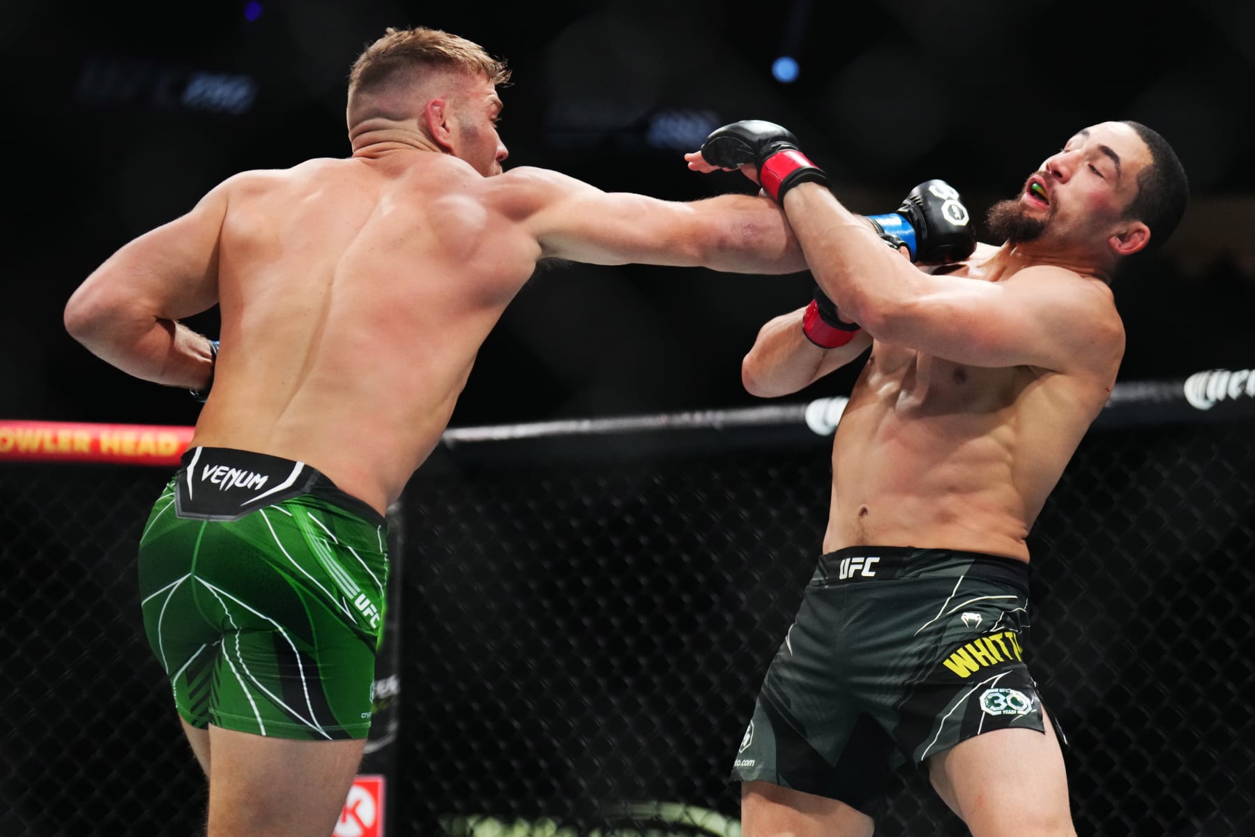 LAS VEGAS, NEVADA - JULY 08: (L-R) Dricus Du Plessis of South Africa punches Robert Whittaker of New Zealand in a middleweight fight during the UFC 290 event at T-Mobile Arena on July 08, 2023 in Las Vegas, Nevada. (Photo by Chris Unger/Zuffa LLC via Getty Images) LAS VEGAS, NEVADA - JULY 08: (L-R) Dricus Du Plessis of South Africa punches Robert Whittaker of New Zealand in a middleweight fight during the UFC 290 event at T-Mobile Arena on July 08, 2023 in Las Vegas, Nevada. (Photo by Chris Unger/Zuffa LLC via Getty Images)