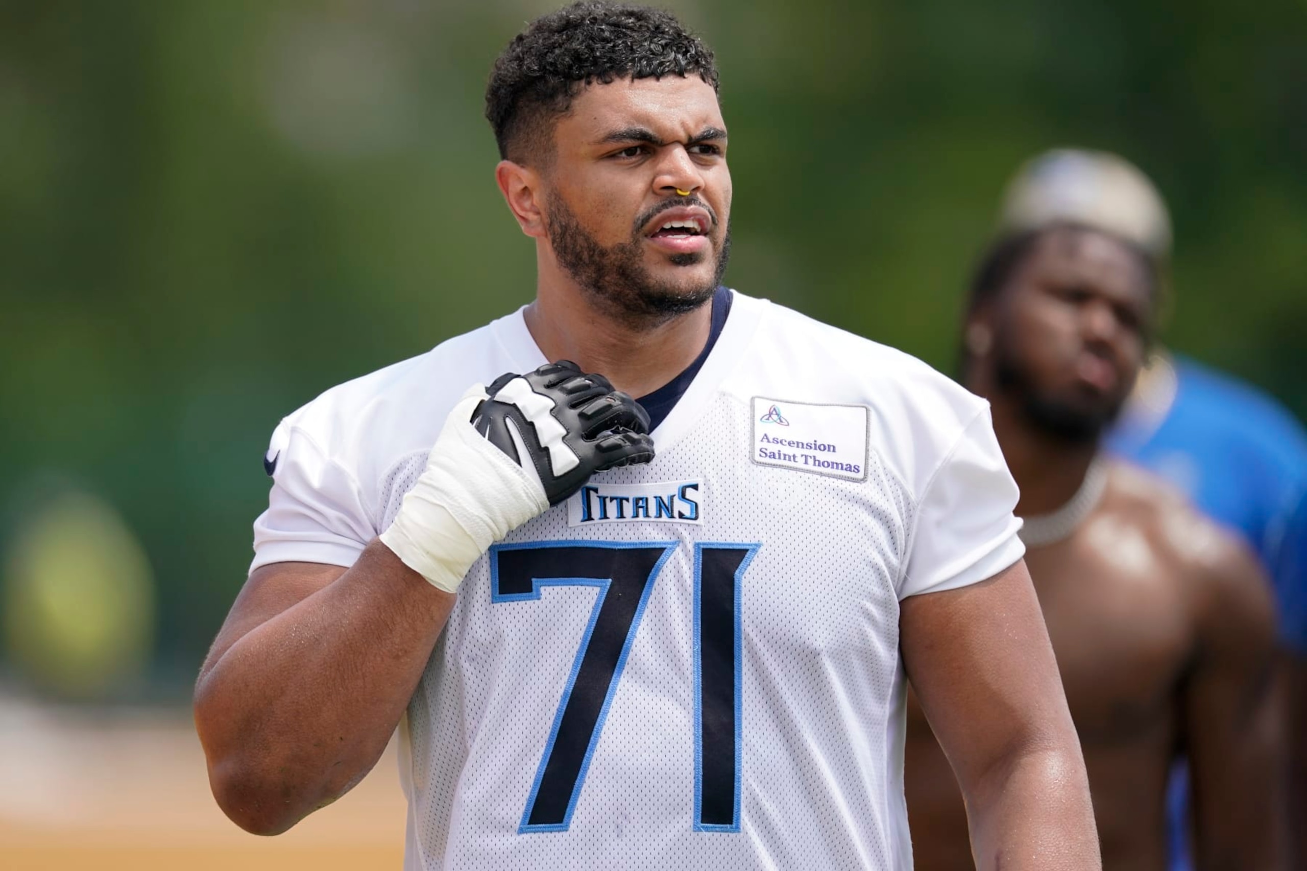 Tennessee Titans offensive tackle Andre Dillard walks off the field after the NFL football team's OTA practices Tuesday, May 23, 2023, in Nashville, Tenn. (AP Photo/George Walker IV)