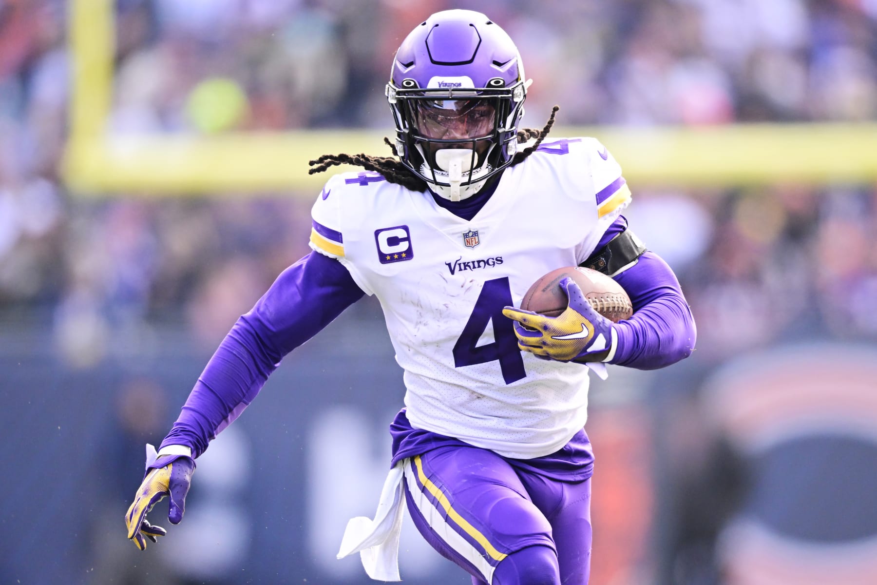 CHICAGO, ILLINOIS - JANUARY 08:  Running back Dalvin Cook #4 of the Minnesota Vikings carries the ball during the game against the Chicago Bears at Soldier Field on January 08, 2023 in Chicago, Illinois. (Photo by Quinn Harris/Getty Images)