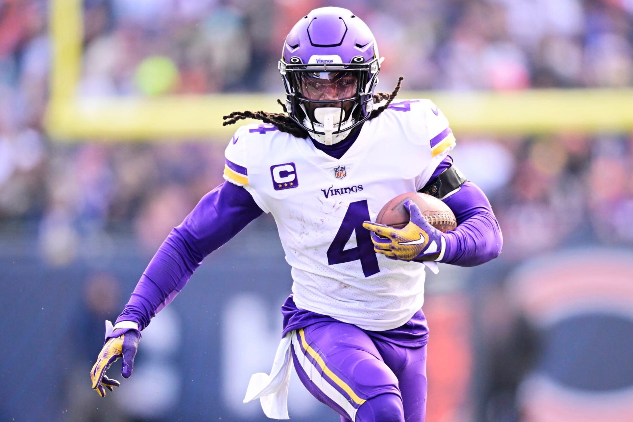 CHICAGO, ILLINOIS - JANUARY 08:  Running back Dalvin Cook #4 of the Minnesota Vikings carries the ball during the game against the Chicago Bears at Soldier Field on January 08, 2023 in Chicago, Illinois. (Photo by Quinn Harris/Getty Images)