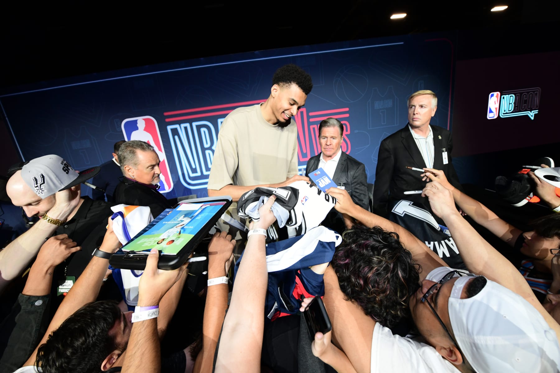 LAS VEGAS, NV - JULY 8: Victor Wembanyama of the San Antonio Spurs signs autographs during NBA Con as part of the 2023 Las Vegas Summer League on July 8, 2023 at the Mandalay Convention Center in Las Vegas, Nevada. NOTE TO USER: User expressly acknowledges and agrees that, by downloading and/or using this Photograph, user is consenting to the terms and conditions of the Getty Images License Agreement. Mandatory Copyright Notice: Copyright 2023 NBAE (Photo by Tom O'Connor/NBAE via Getty Images)