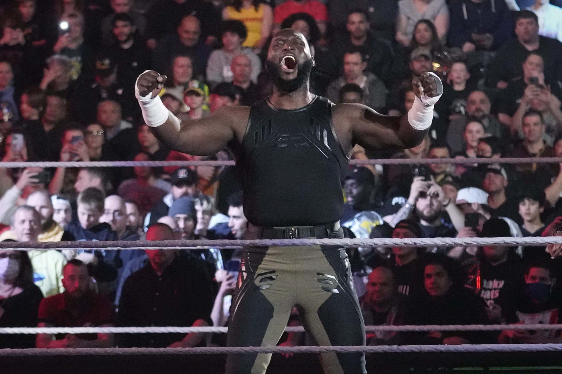 Wrester Omos is introduced during the WWE Monday Night RAW event, Monday, March 6, 2023, in Boston. (AP Photo/Charles Krupa)