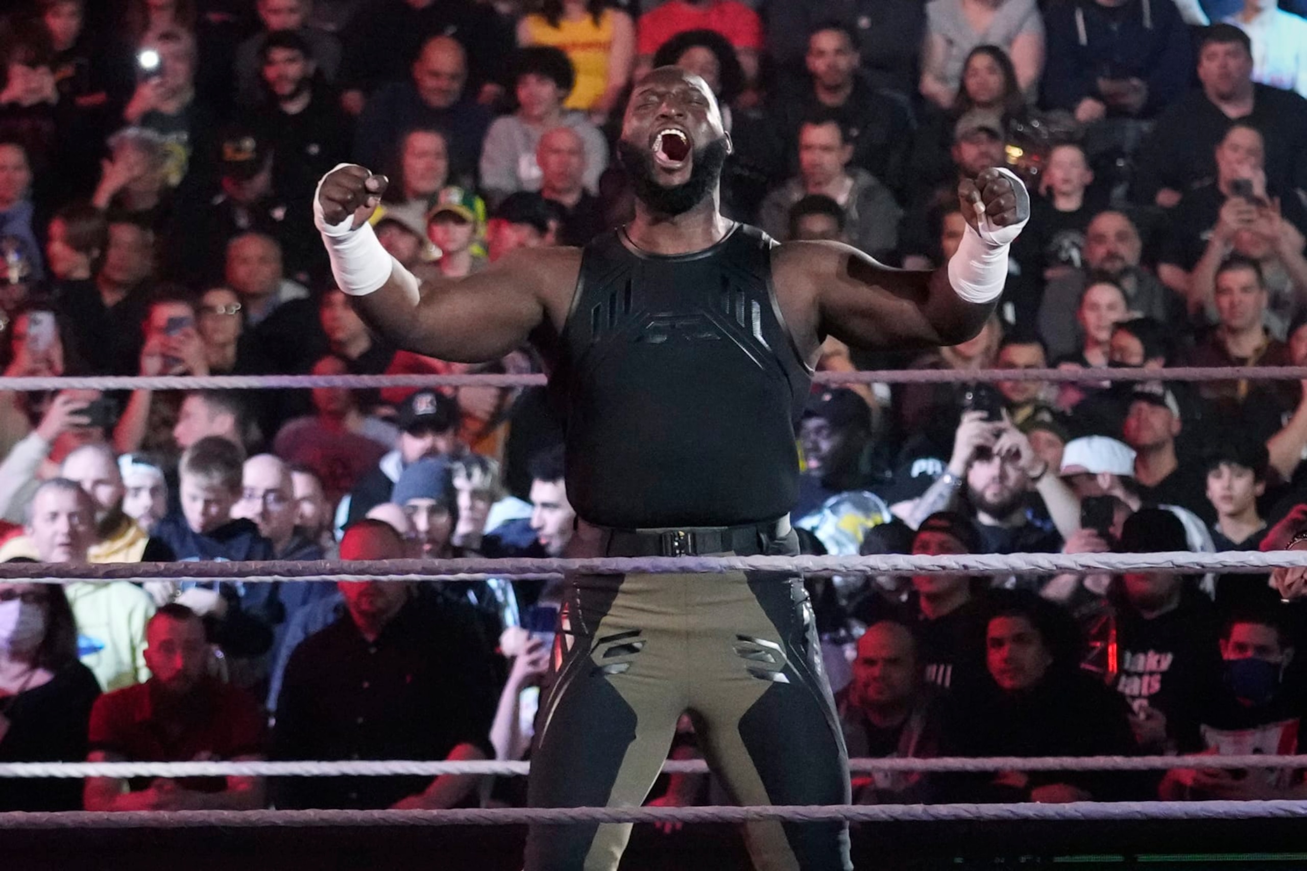 Wrester Omos is introduced during the WWE Monday Night RAW event, Monday, March 6, 2023, in Boston. (AP Photo/Charles Krupa)
