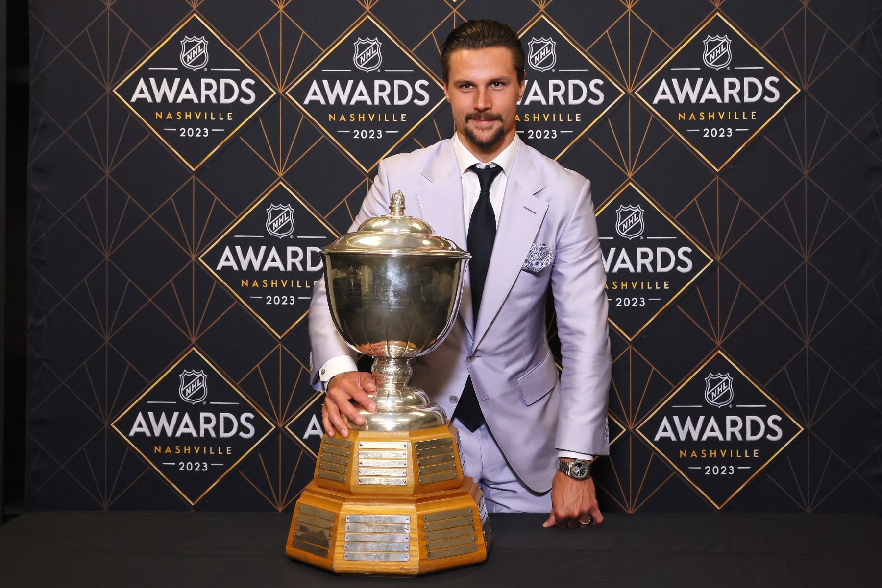 San Jose Sharks defenseman Erik Karlsson poses with the James Norris Memorial Trophy at the 2023 NHL Awards.