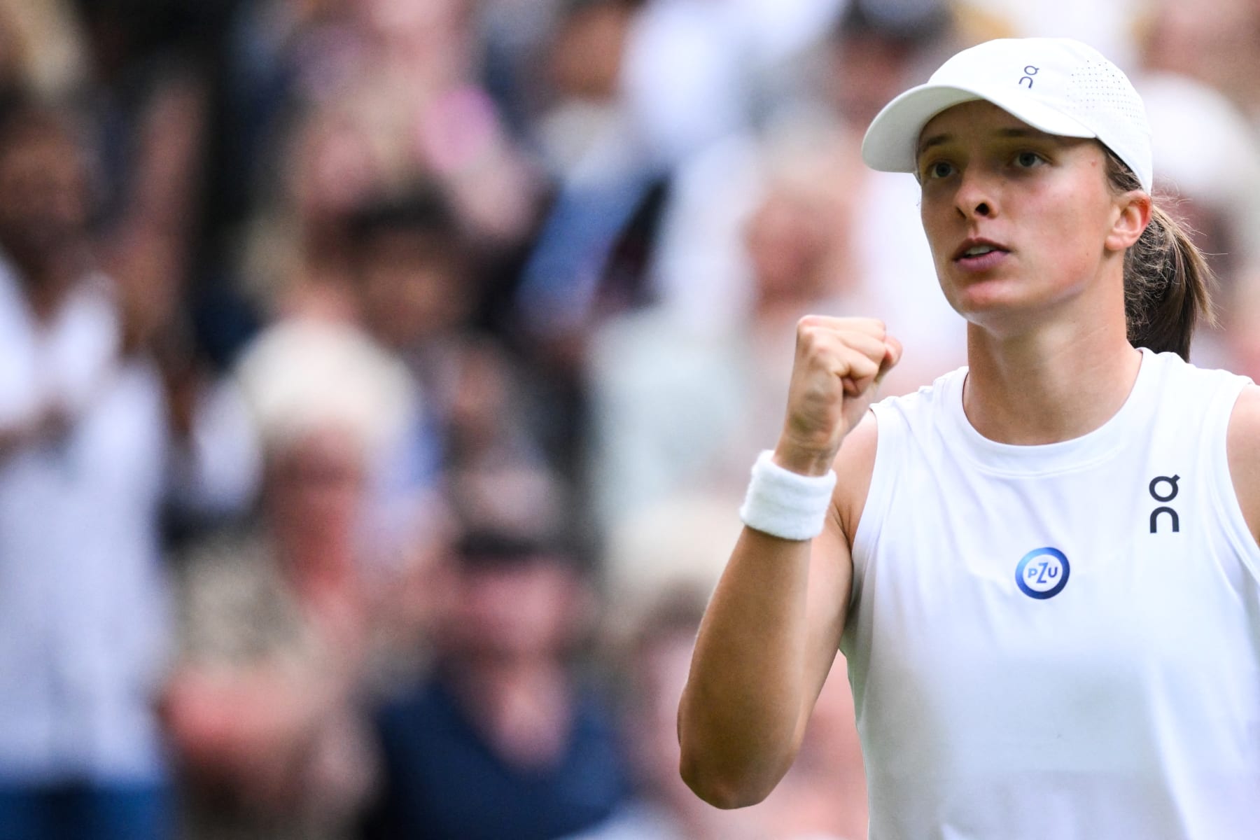 Poland's Iga Swiatek celebrates winning against Switzerland's Belinda Bencic during their women's singles tennis match on the seventh day of the 2023 Wimbledon Championships at The All England Tennis Club in Wimbledon, southwest London, on July 9, 2023. (Photo by Daniel LEAL / AFP) / RESTRICTED TO EDITORIAL USE (Photo by DANIEL LEAL/AFP via Getty Images) Poland's Iga Swiatek celebrates winning against Switzerland's Belinda Bencic during their women's singles tennis match on the seventh day of the 2023 Wimbledon Championships at The All England Tennis Club in Wimbledon, southwest London, on July 9, 2023. (Photo by Daniel LEAL / AFP) / RESTRICTED TO EDITORIAL USE (Photo by DANIEL LEAL/AFP via Getty Images)