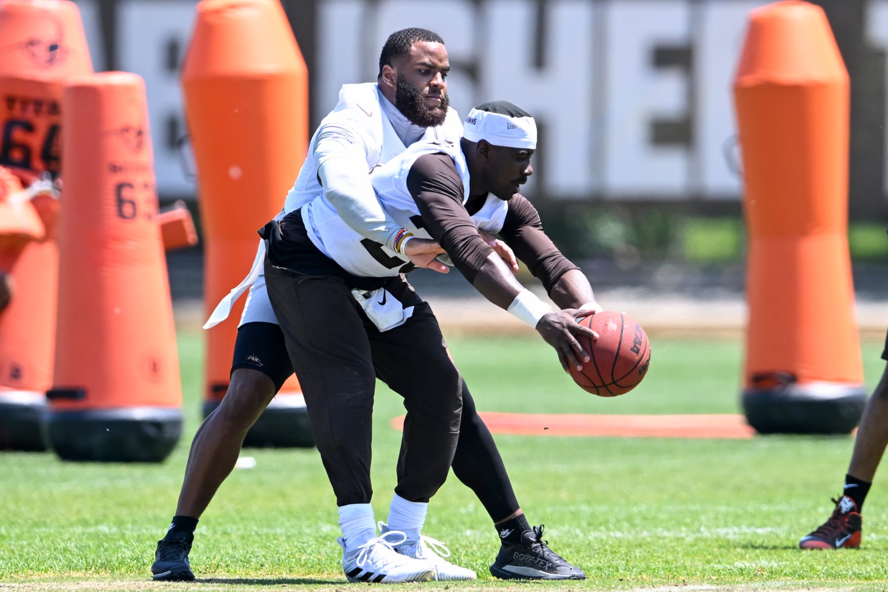 BEREA, OHIO - MAY 31: Jeremiah Owusu-Koramoah #28 and Anthony Walker Jr. #5 of the Cleveland Browns play basketball during the Cleveland Browns OTAs at CrossCountry Mortgage Campus on May 31, 2023 in Berea, Ohio. (Photo by Nick Cammett/Diamond Images via Getty Images)