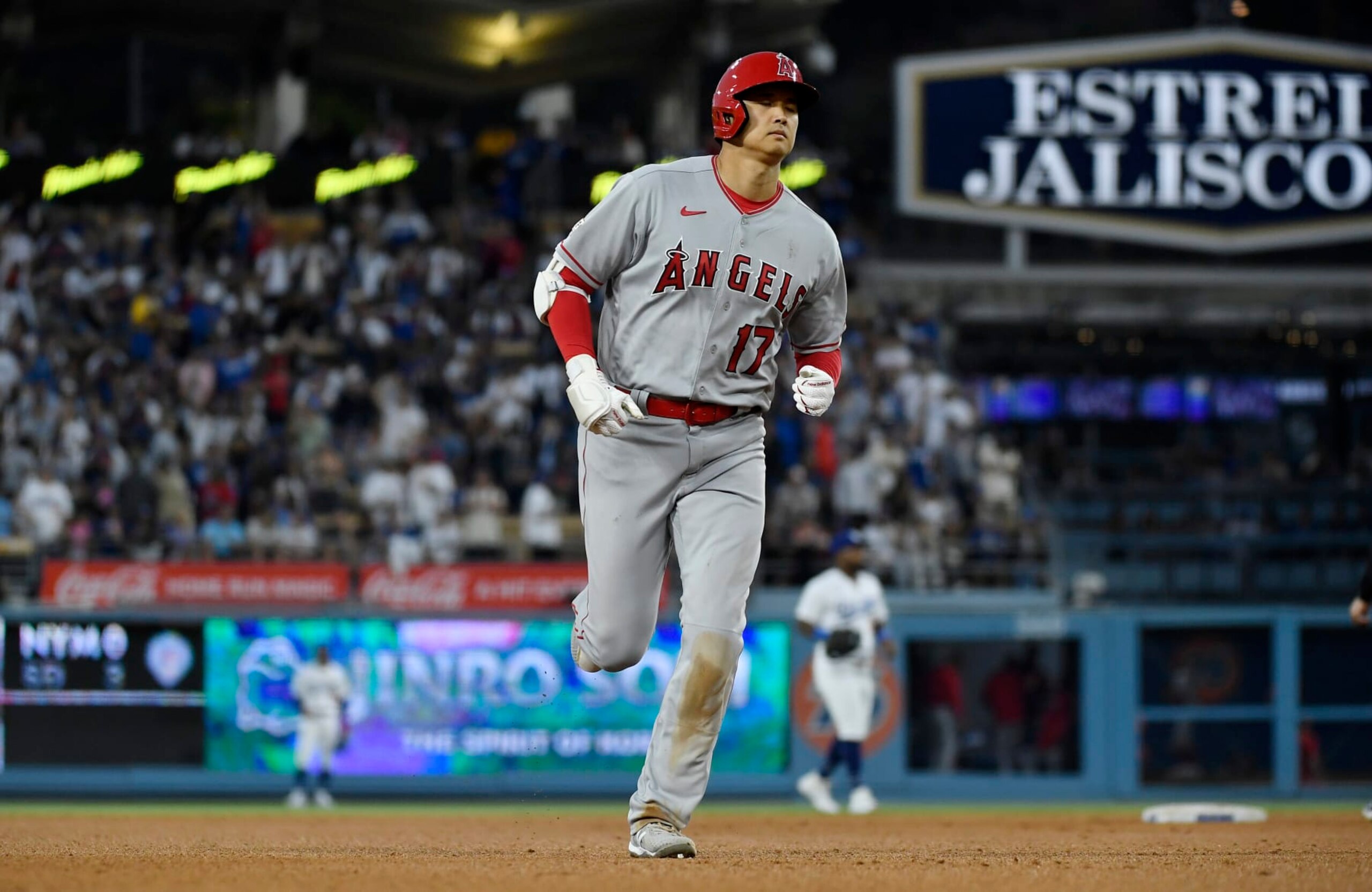LOS ANGELES, CALIFORNIA - JULY 8: Shohei Ohtani #17 of the Los Angeles Angels runs the bases after hitting a two run homer un to score Andrew Velazquez #4 against pitcher pitcher Michael Grove #78 of the Los Angeles Dodgers during the seventh inning at Dodger Stadium on July 8, 2023 in Los Angeles, California. (Photo by Kevork Djansezian/Getty Images)