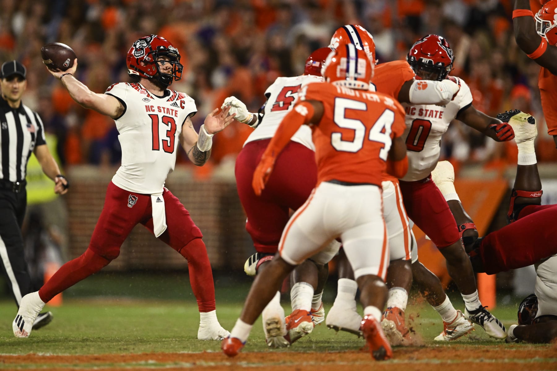 CLEMSON, SOUTH CAROLINA - OCTOBER 01: Devin Leary #13 of the North Carolina State Wolfpack throws a pass against the Clemson Tigers in the second quarter at Memorial Stadium on October 01, 2022 in Clemson, South Carolina. (Photo by Eakin Howard/Getty Images)