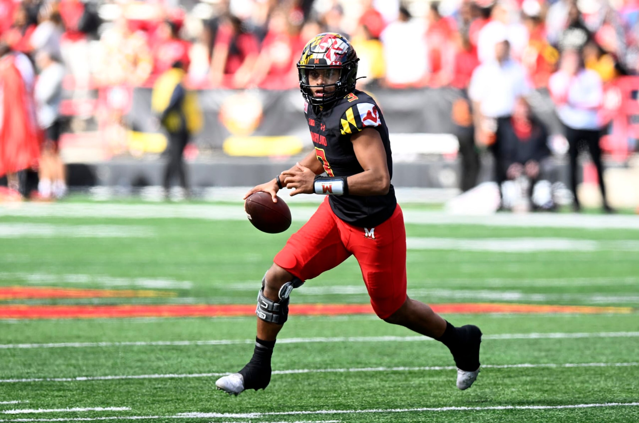 COLLEGE PARK, MARYLAND - OCTOBER 08: Taulia Tagovailoa #3 of the Maryland Terrapins rolls out of the pocket against the Purdue Boilermakers at SECU Stadium on October 08, 2022 in College Park, Maryland. (Photo by G Fiume/Getty Images)