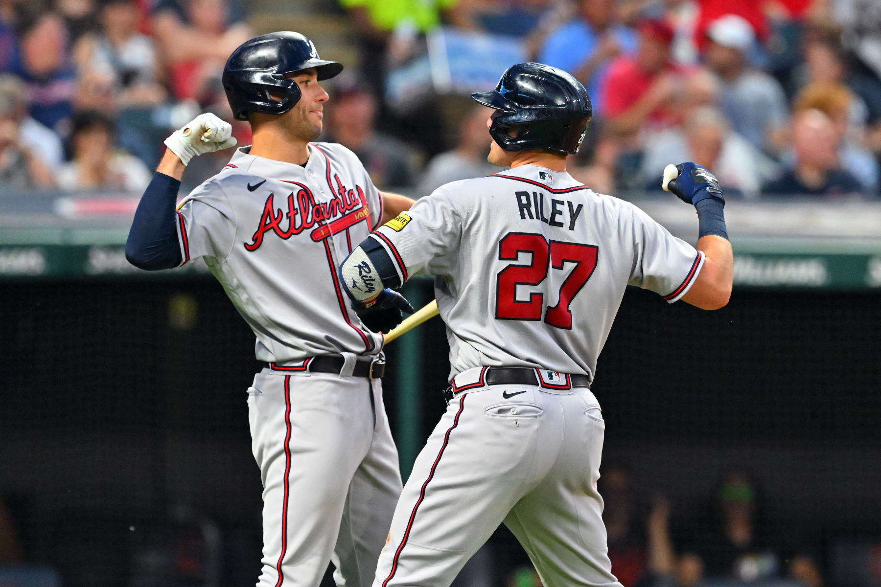 CLEVELAND, OHIO - JULY 05: Austin Riley #27 of the Atlanta Braves celebrates his solo homer with Matt Olson #28 in the seventh inning against the Cleveland Guardians at Progressive Field on July 05, 2023 in Cleveland, Ohio. (Photo by Jason Miller/Getty Images)