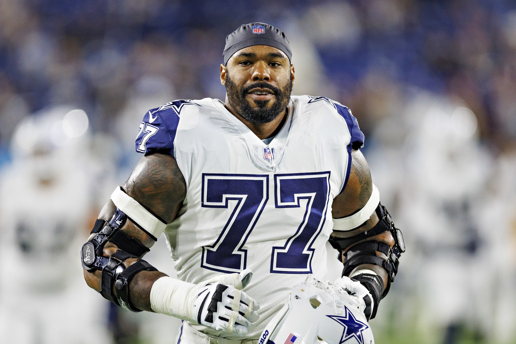 NASHVILLE, TENNESSEE - DECEMBER 29:  Tyron Smith #77 of the Dallas Cowboys jogs to the locker room before a game against the Tennessee Titans at Nissan Stadium on December 29, 2022 in Nashville, Tennessee. The Cowboys defeated the Titans 27-13. (Photo by Wesley Hitt/Getty Images)