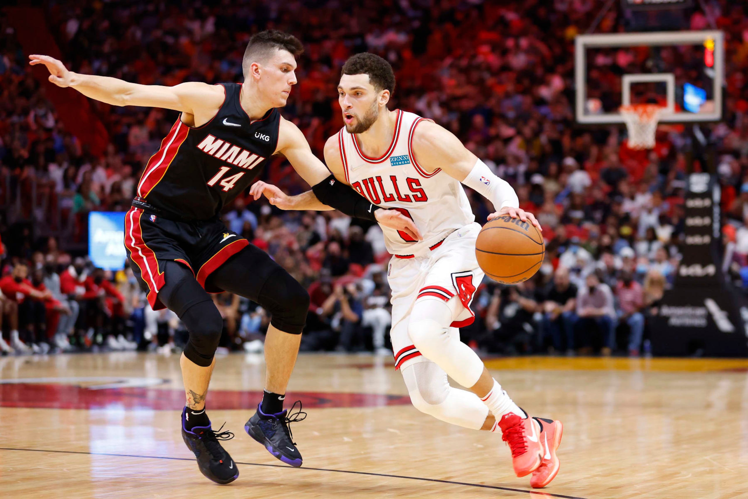 MIAMI, FLORIDA - DECEMBER 11: Zach LaVine #8 of the Chicago Bulls drives to the basket against Tyler Herro #14 of the Miami Heat during the second half at FTX Arena on December 11, 2021 in Miami, Florida. NOTE TO USER: User expressly acknowledges and agrees that, by downloading and or using this photograph, User is consenting to the terms and conditions of the Getty Images License Agreement. (Photo by Michael Reaves/Getty Images)