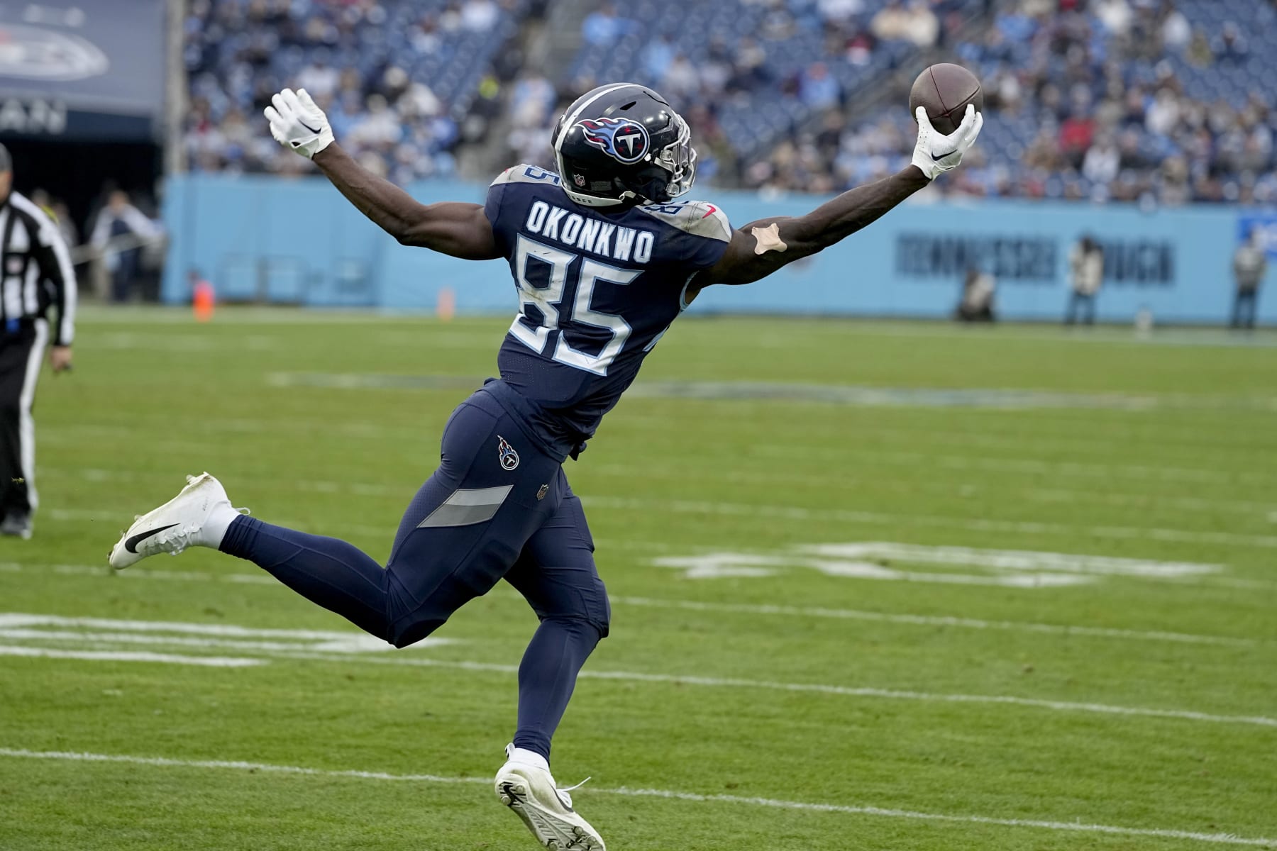 Tennessee Titans tight end Chigoziem Okonkwo catches a pass for a successful 2-point conversion during the second half of an NFL football game against the Jacksonville Jaguars Sunday, Dec. 11, 2022, in Nashville, Tenn. (AP Photo/Chris Carlson)
