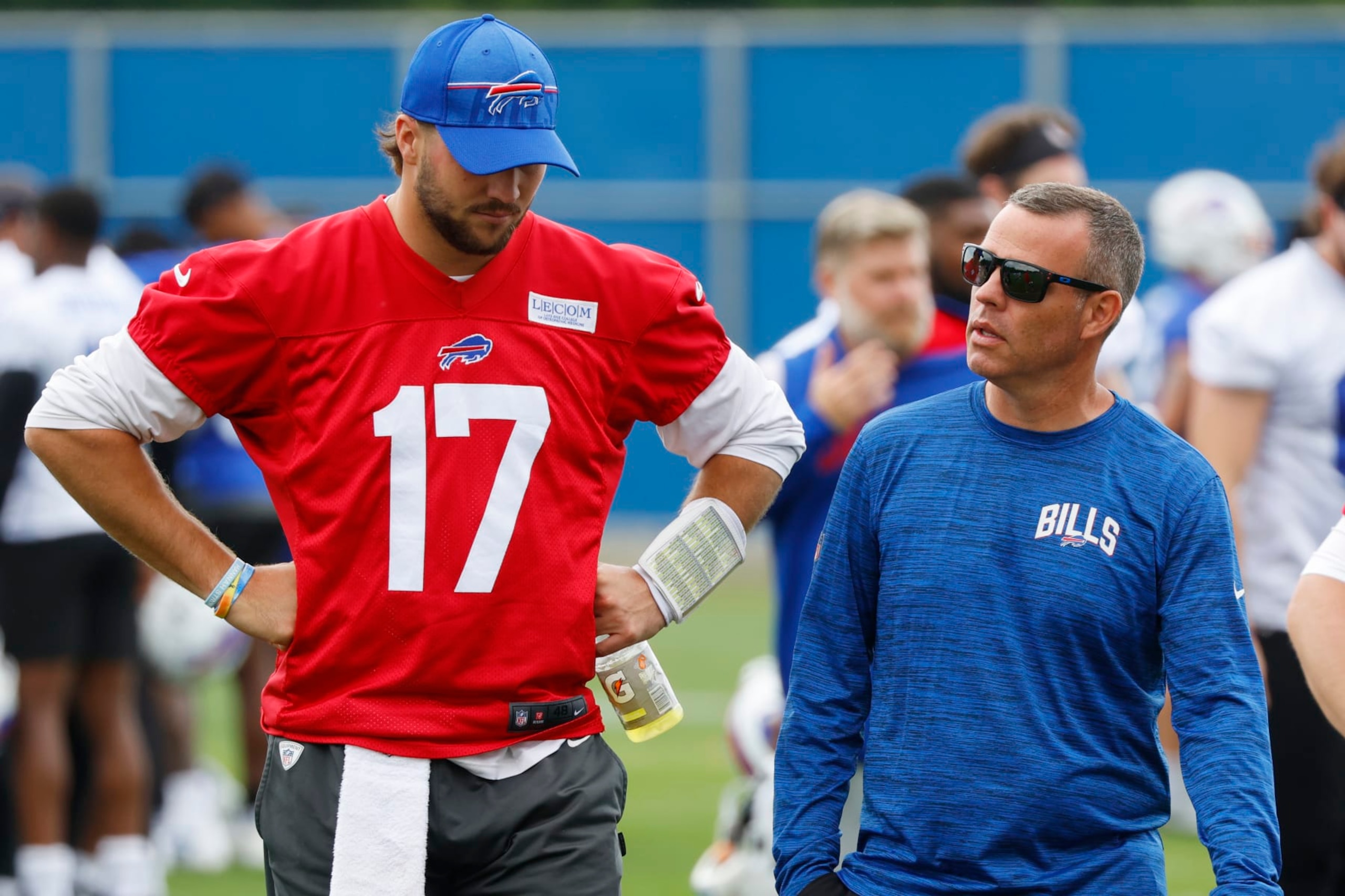 Buffalo Bills quarterback Josh Allen (17) and General Manager Brandon Beane talk following NFL football practice in Orchard Park, N.Y., Tuesday June 13, 2023. (AP Photo/Jeffrey T. Barnes)