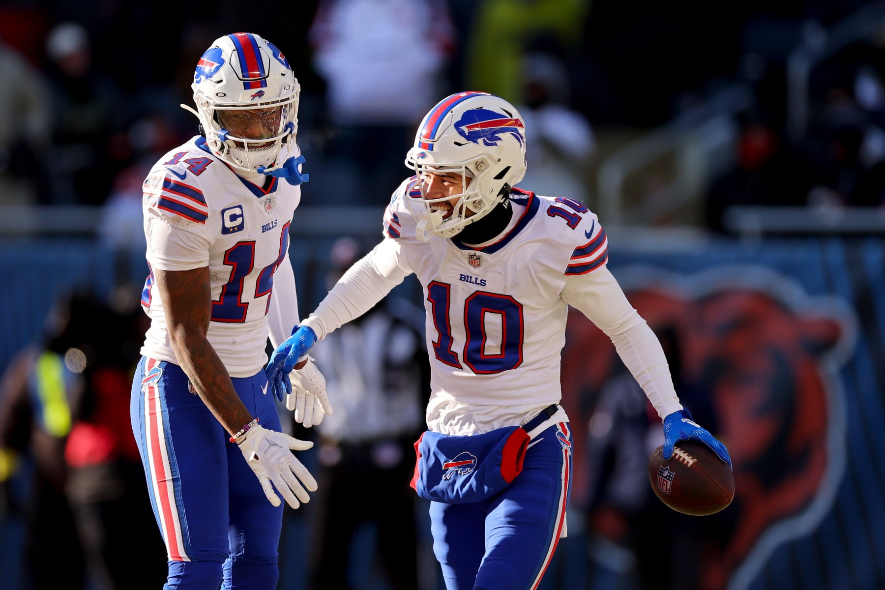 CHICAGO, ILLINOIS - DECEMBER 24: Khalil Shakir #10 and Stefon Diggs #14 of the Buffalo Bills celebrate a two point conversion during the third quarter in the game against the Chicago Bears at Soldier Field on December 24, 2022 in Chicago, Illinois. (Photo by Michael Reaves/Getty Images)