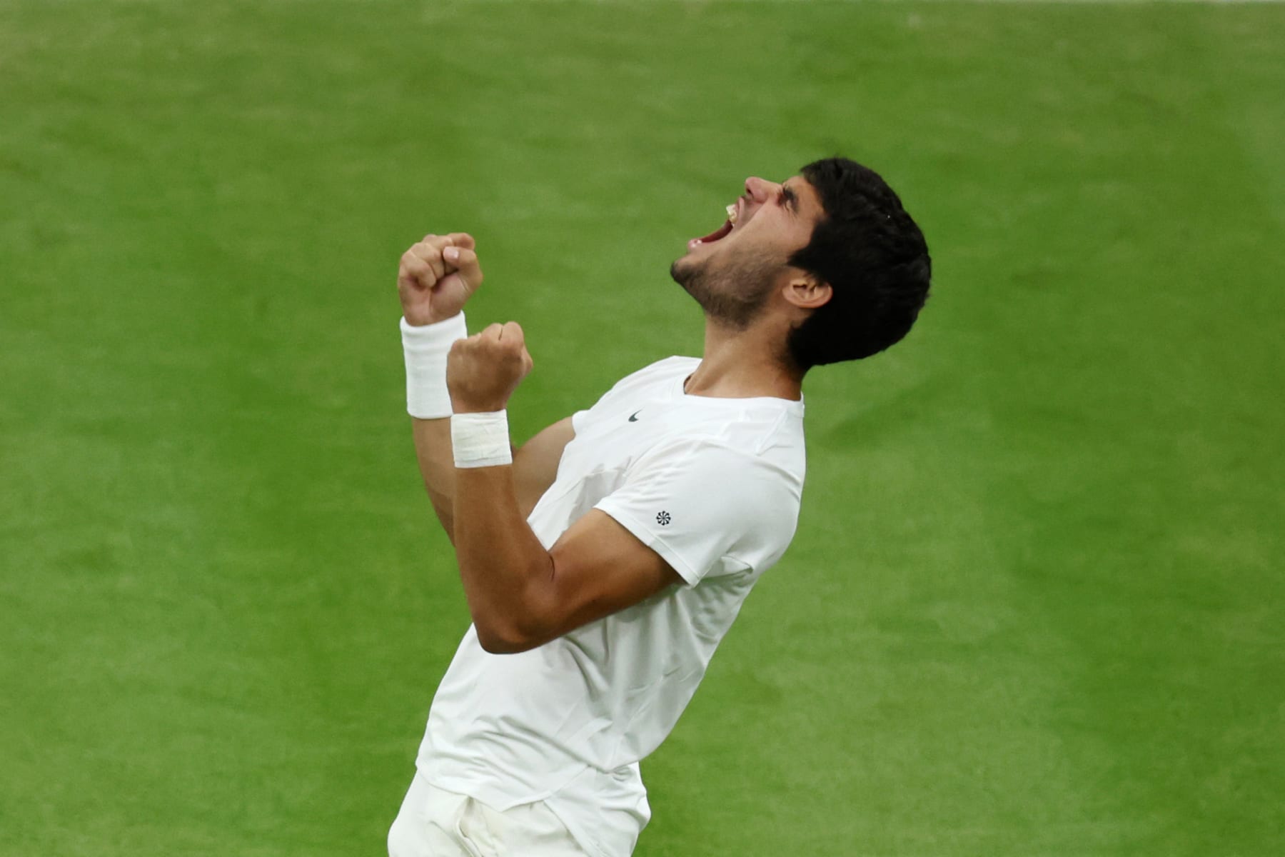 LONDON, ENGLAND - JULY 10: Carlos Alcaraz of Spain celebrates victory against Matteo Berrettini of Italy in the Men's Singles fourth round match during day eight of The Championships Wimbledon 2023 at All England Lawn Tennis and Croquet Club on July 10, 2023 in London, England. (Photo by Clive Brunskill/Getty Images)