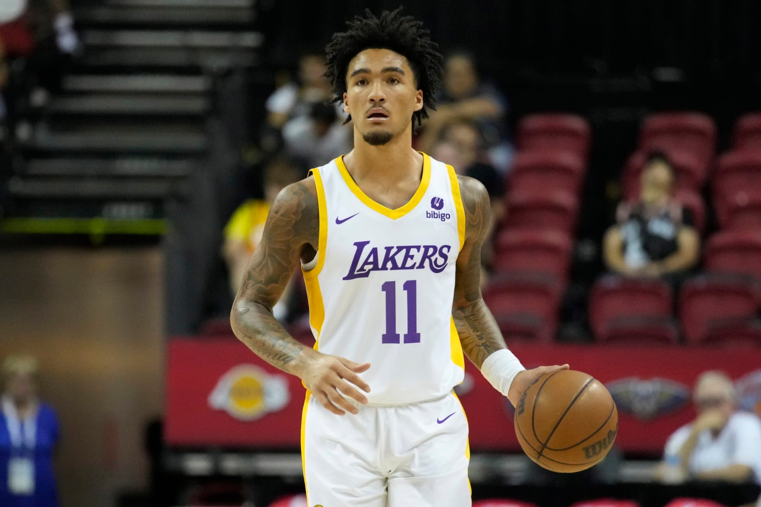 Los Angeles Lakers' Jalen Hood-Schifino drives up the court against the Golden State Warriors during the second half of an NBA summer league basketball game Friday, July 7, 2023, in Las Vegas. (AP Photo/John Locher)